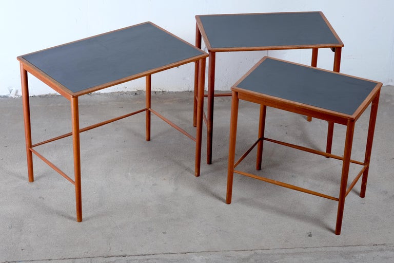 Set of teak nesting tables by Grete Jalk for Poul Jeppesens Møbelfabrik.
The amazing finesse of this nest of tables is remarkable. The tables are in teak with black formica tops. The tables are in good vintage condition, with a little age related