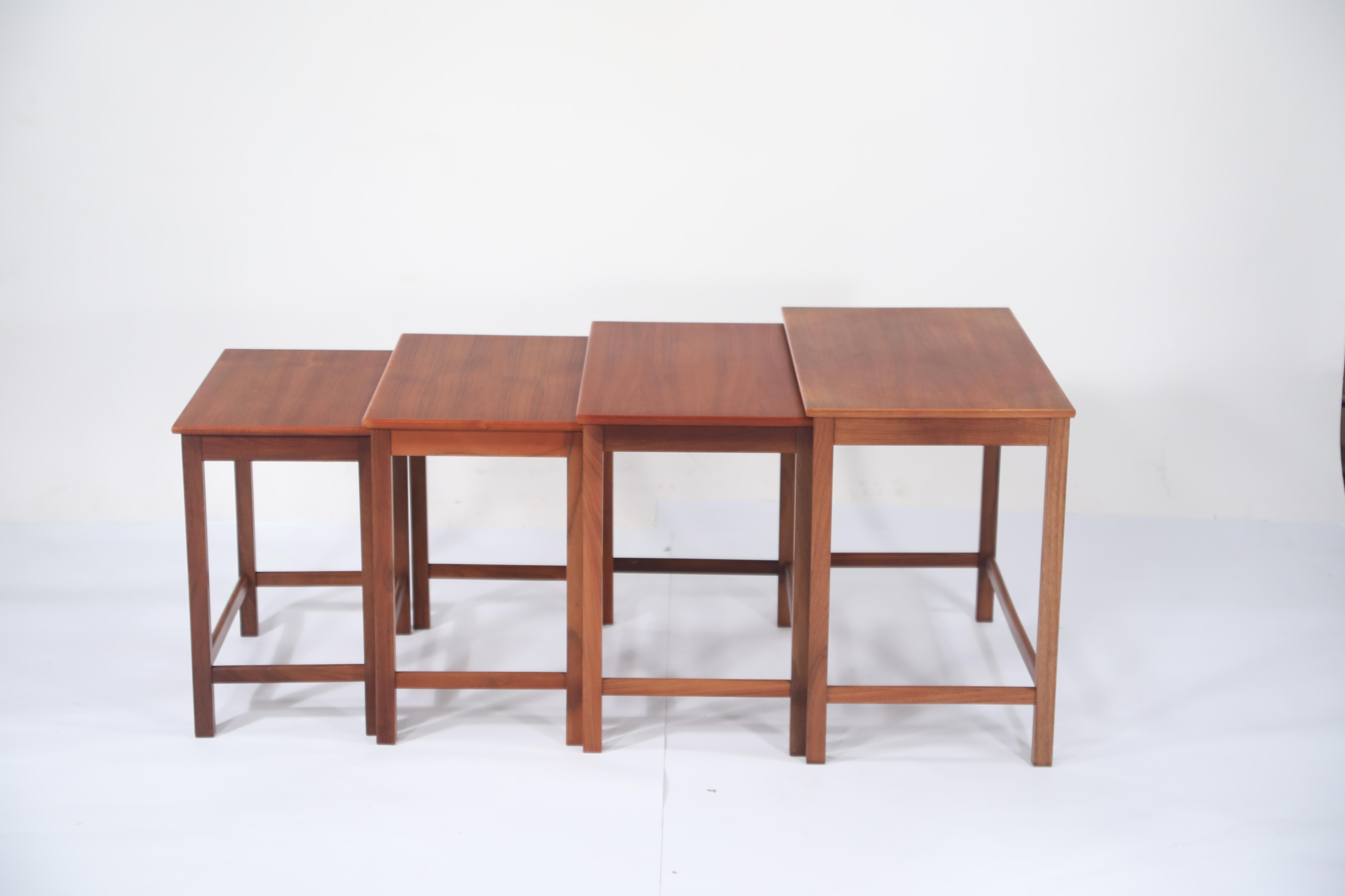 An gorgeous set of four (4) signed teak nesting tables designed by Peter Hvidt and Orla Molgaard Nielsen for Illums Bolighus. This set of nesting tables is in its original beautiful finish, sturdy and structurally sound and ready to be used