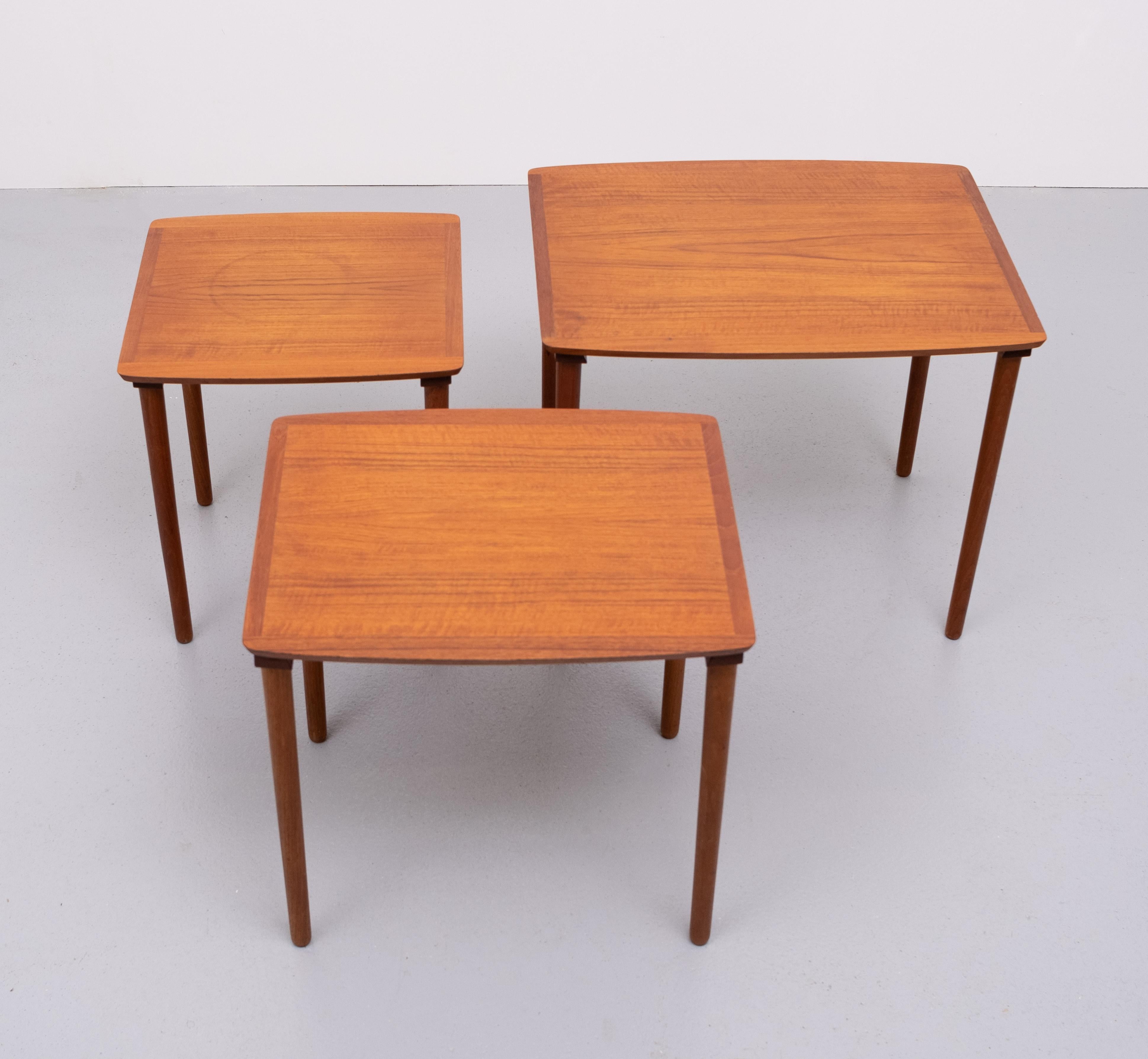 Very nice set off Teak nesting tables. manufactured by Mobelintarsia Denmark 1960. Three tables hanging in a rail underneath each other good condition. 
 Measures: Large height 45 cm width 55 cm depth 44 cm 
 Middle height 43 cm width 46 cm depth