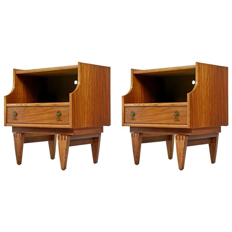 This elegant set of Mid-Century Modern teak nightstands were created by The Stanley Furniture Company in the 1960s. The straight line construction and unique brass drawer pulls add to the appeal. We preserved their patina during the otherwise