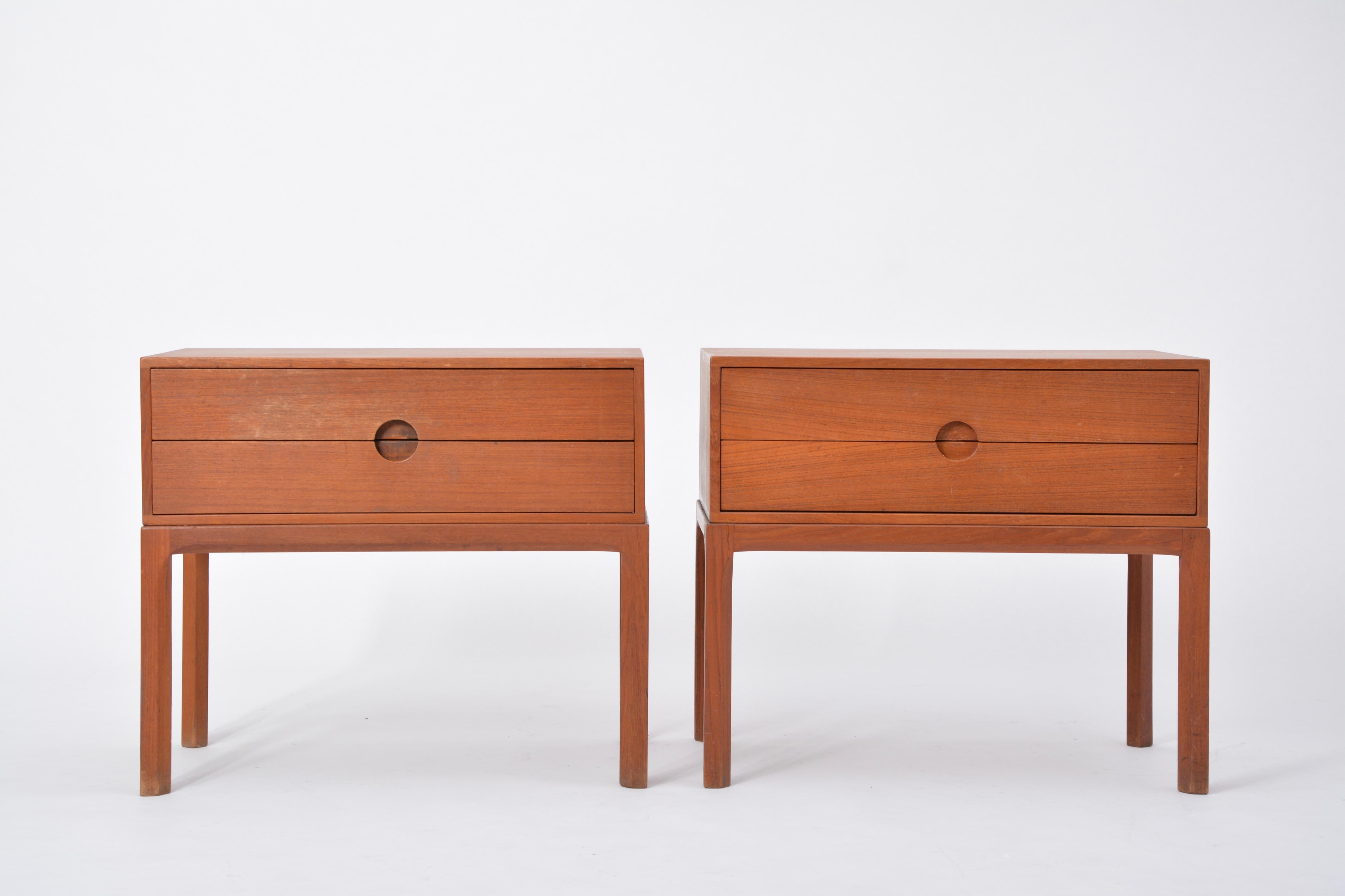 Pair of night cabinets designed by Kai Kristiansen and manufactured by Aksel Kjersgaard Odder Mobelfabrik, Denmark 1955. This set of cabinets is made of teak wood and has beautiful detailed lines typical for Aksel Kjersgaards work. Both cabinets