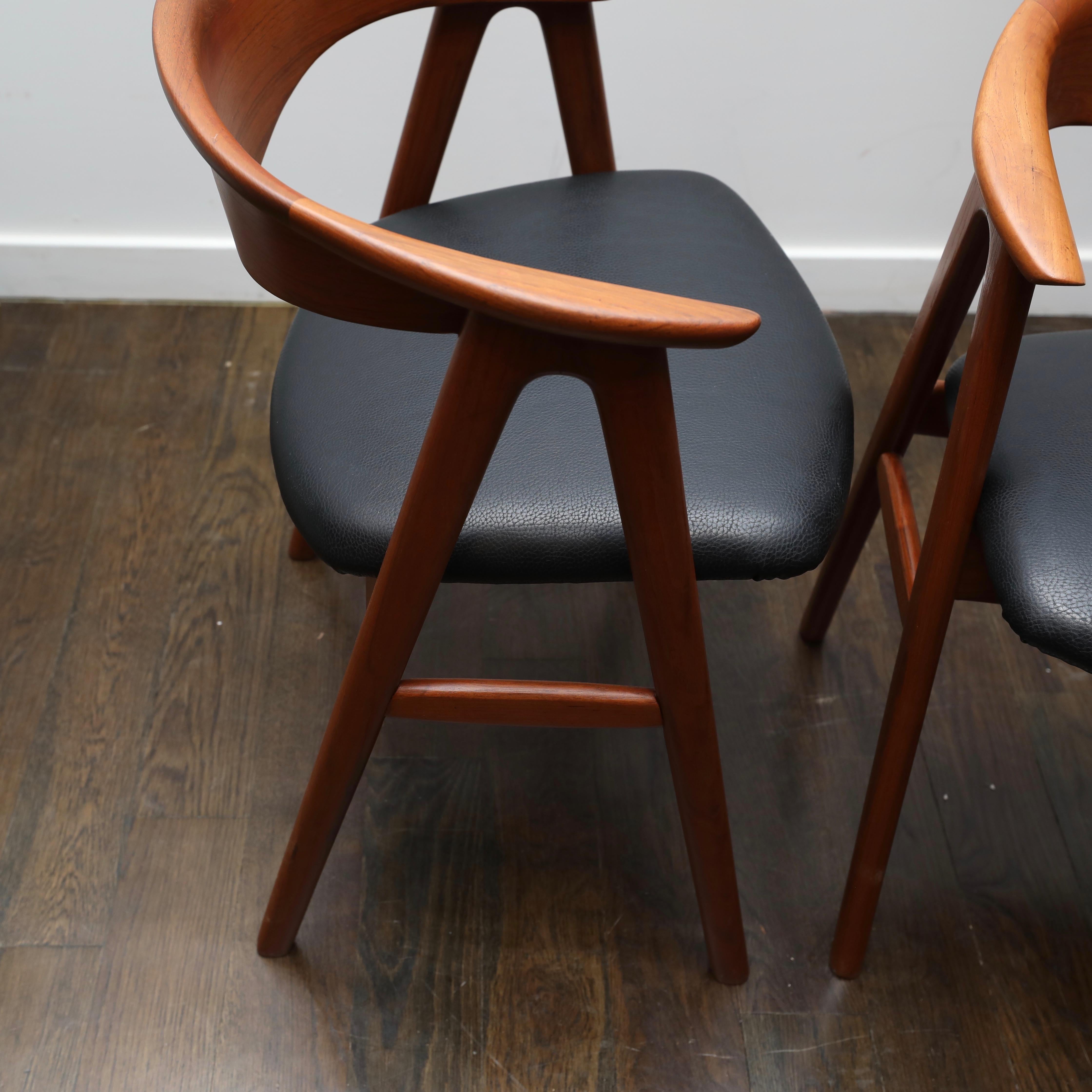 Beautifully restored pair of teak armchairs by Erik Kirkegaard from the 1960s. Brand new leather upholstered seats.