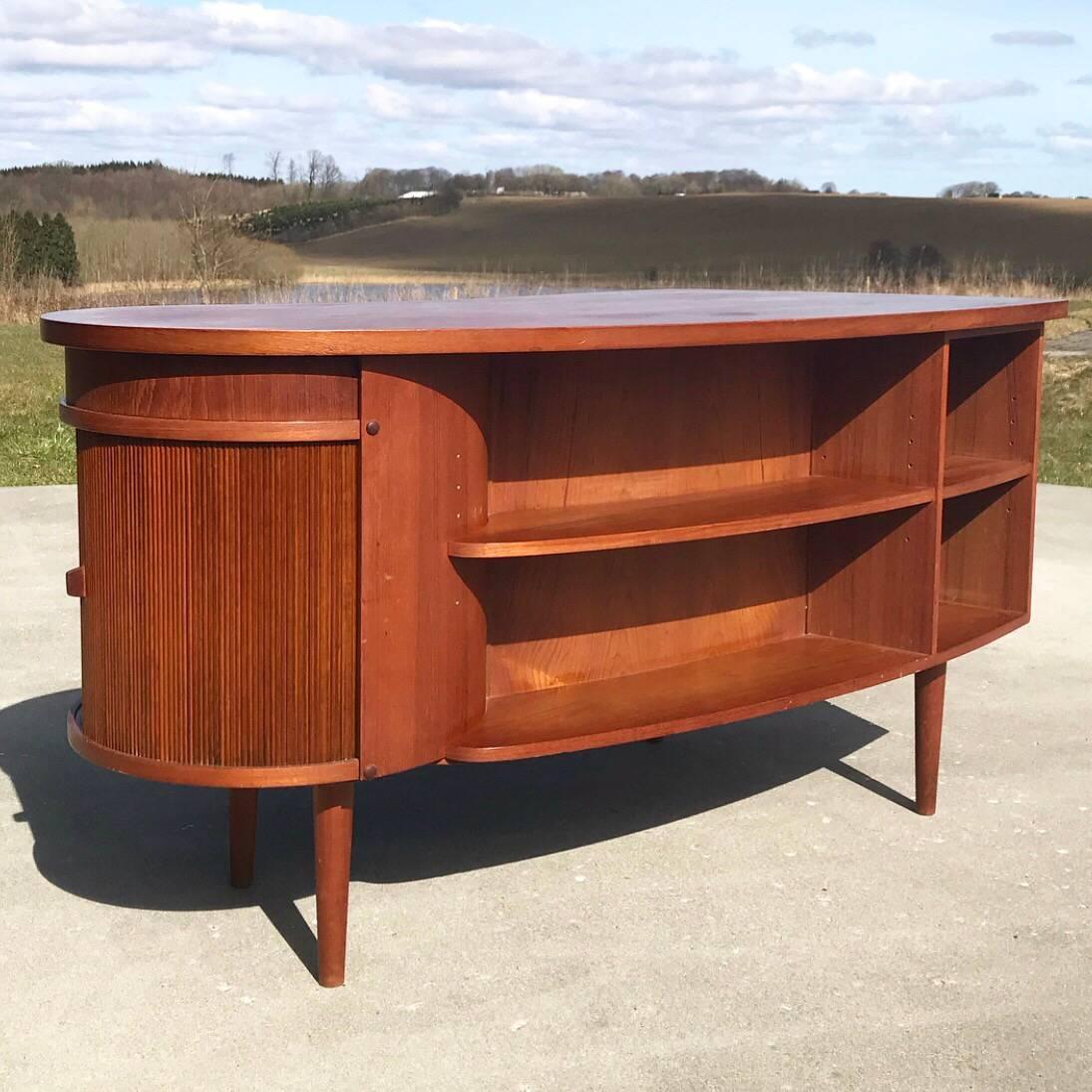Teak office desk model 54 designed by Kai Kristiansen for Feldballe Møbelfabrik back in the 1960s. 

the iconic and rare teak desk is designed to stand open in the room as there should be acces to both front and back  of the desk.

Four book shelves