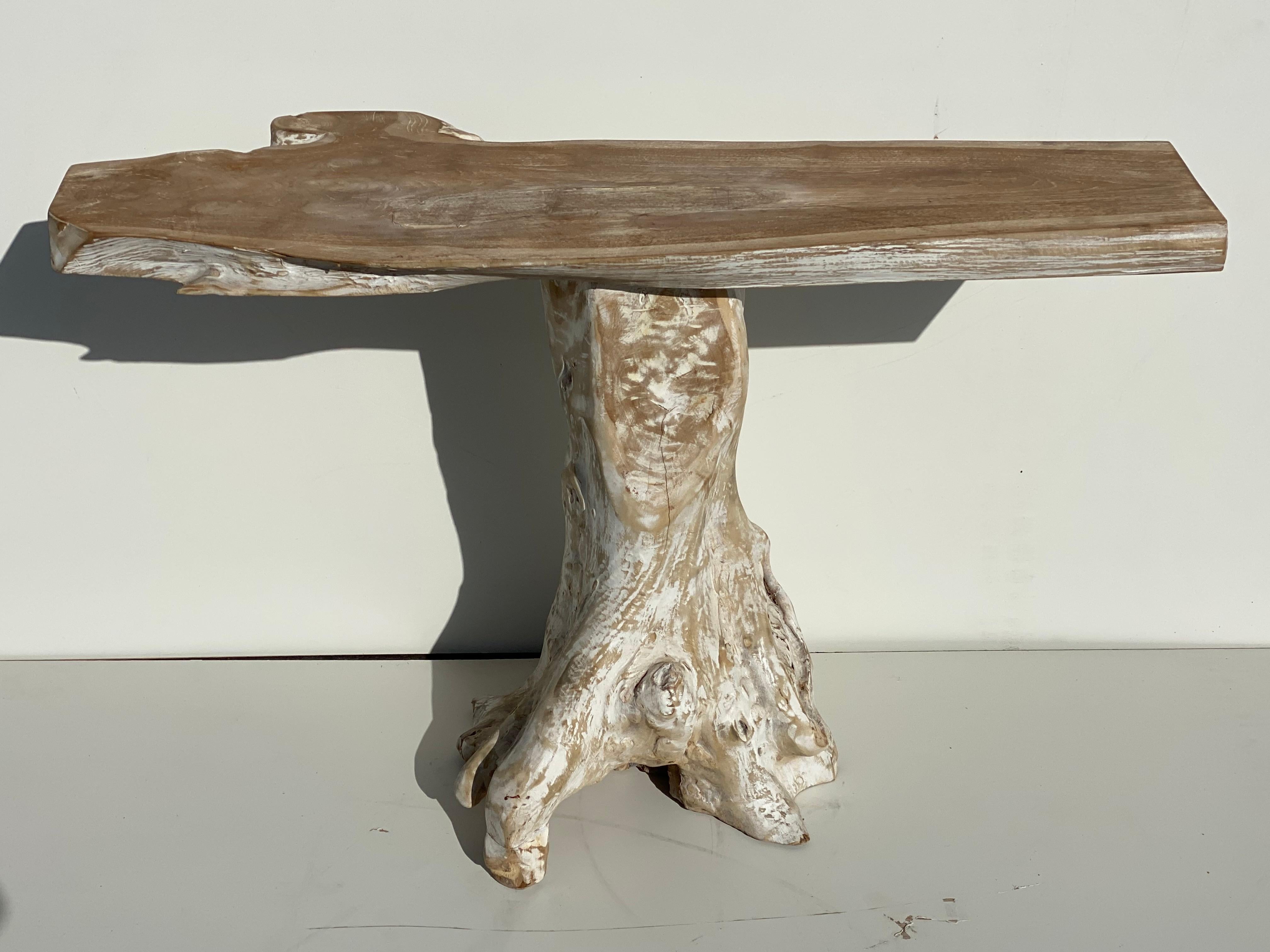 Teak root console table in white wash finish. Top is 47