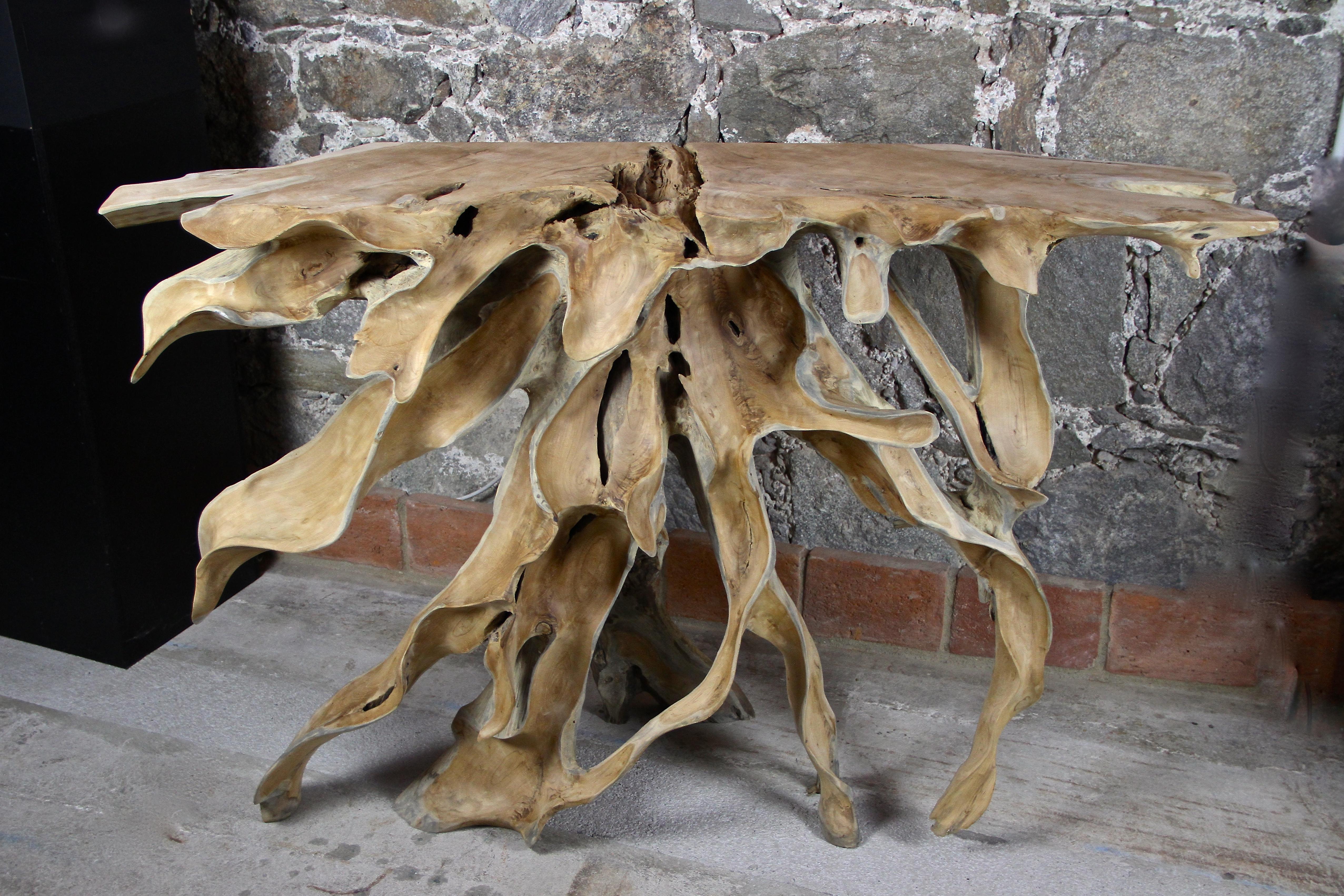 Out of the ordinary teak root console table or sideboard. The artist artfully cutted this piece out of one huge teak root and built this unique console called 