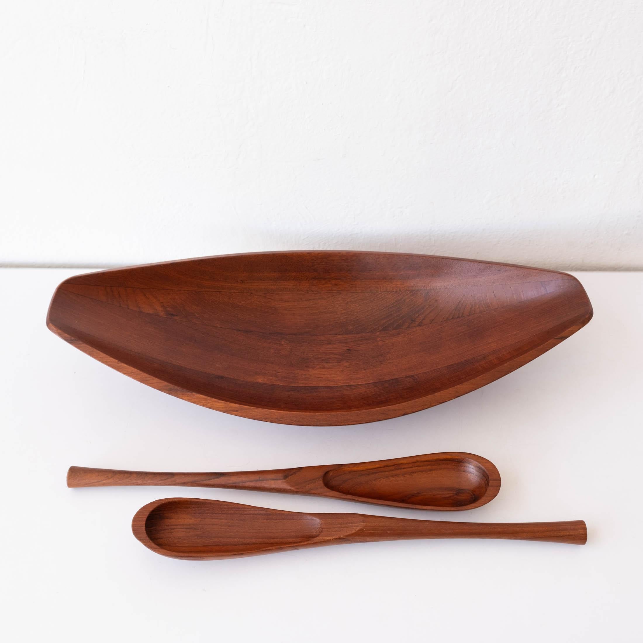Canoe salad bowl by Jens Quistgaard for Dansk with serving tongs. Staved teak. Both the bowl and tongs have early Dansk marks. Denmark, 1950s.

Jens Harald Quistgaard (1919-2008) was a Danish sculptor and designer, known principally for his work for