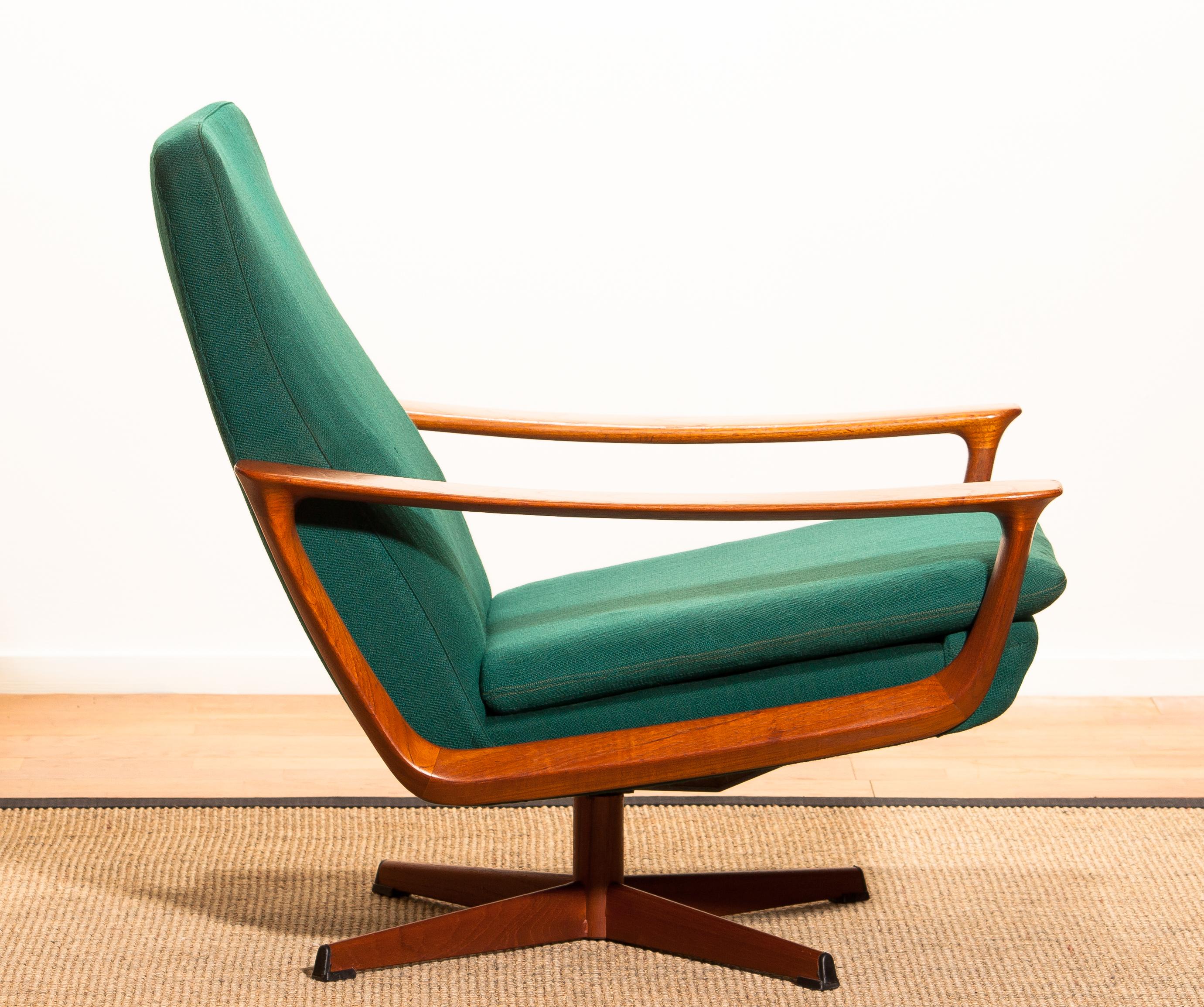 Extremely rare teak swivel chair by Johannes Andersen for Trensums, Denmark. 
The chair to the right is in excellent condition. Upholstery and padding shows wear consistent with age and use.
The chair to the left is also in perfect condition