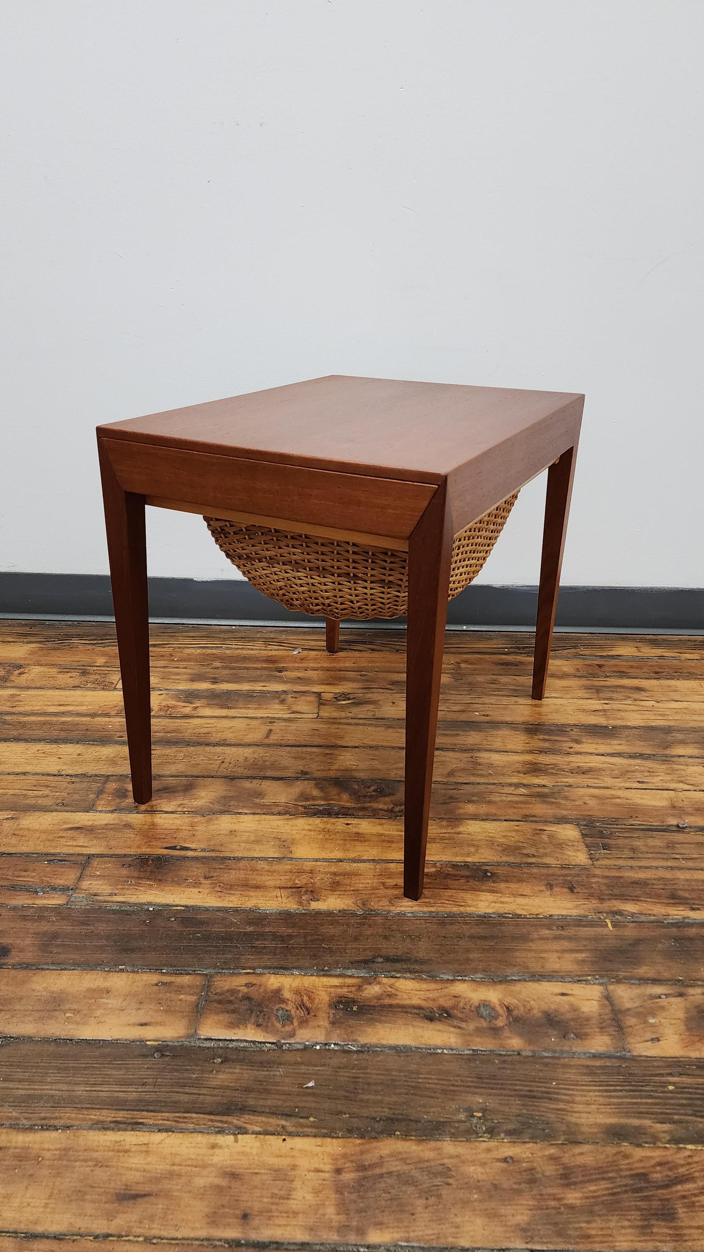Beautiful teak Sewing table with drawer and basket.  basket is in excellent condition and the top has had a light refinish.  this sewing table is one of my favorite pieces. the detail at the corner is excellent. 