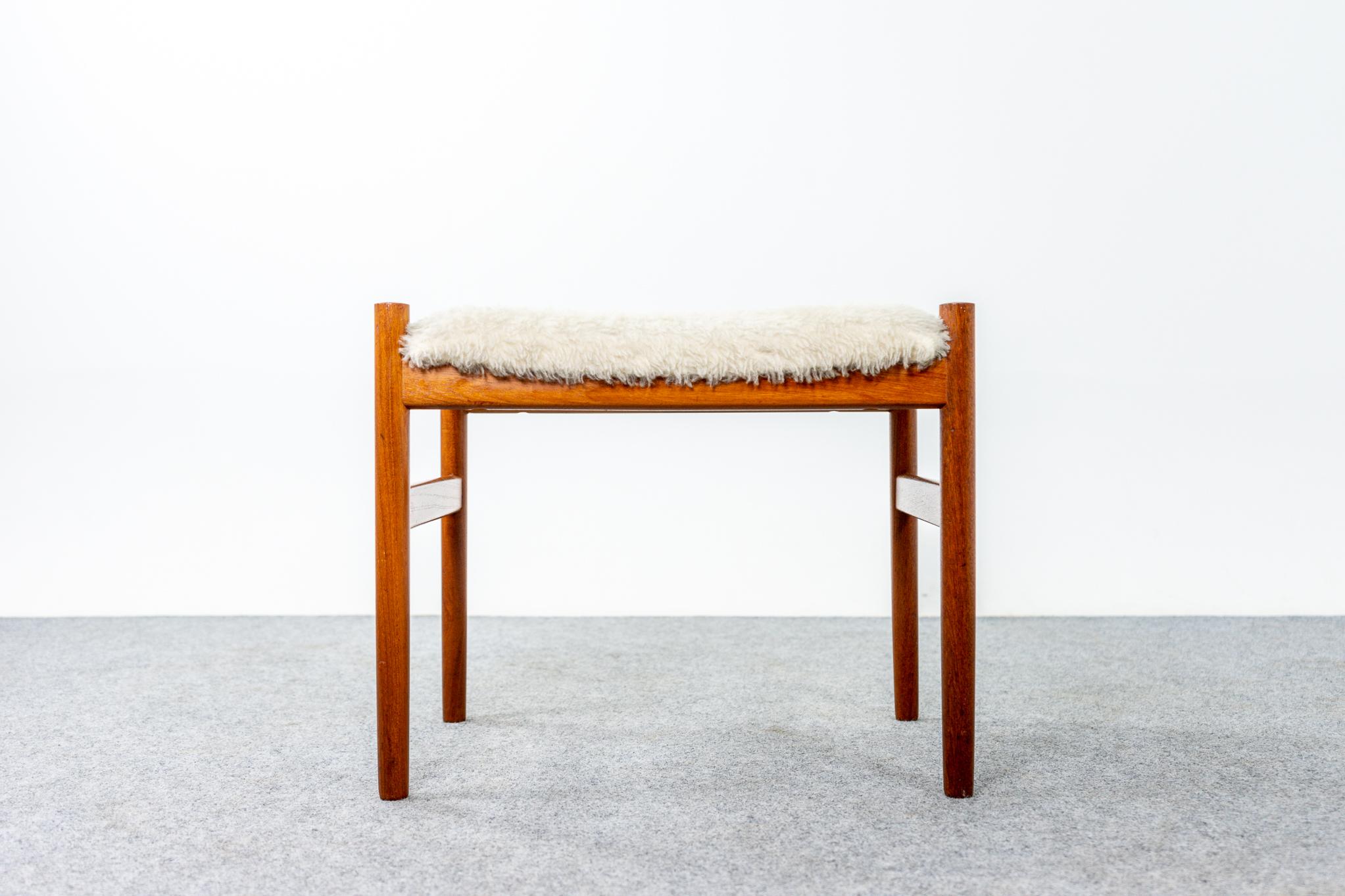 Teak and shearling footstool designed by Hugo Frandsen for Spottrup, circa 1960's. Compact design, can be used with virtually any seating type, easy to move around the home too! Underside of chair shows Spottrup makers' mark.

Unrestored item,