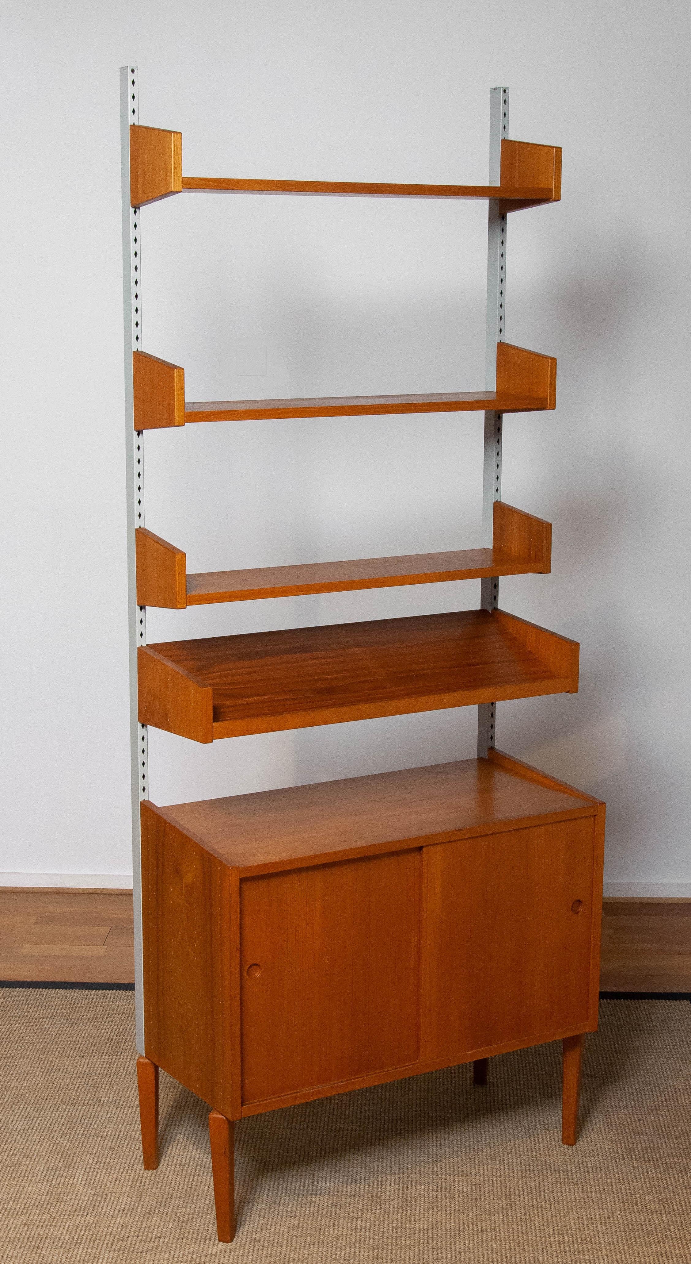 Swedish Teak Shelf System / Bookcase In Teak With Steel Bars By Harald Lundqvist 1950's