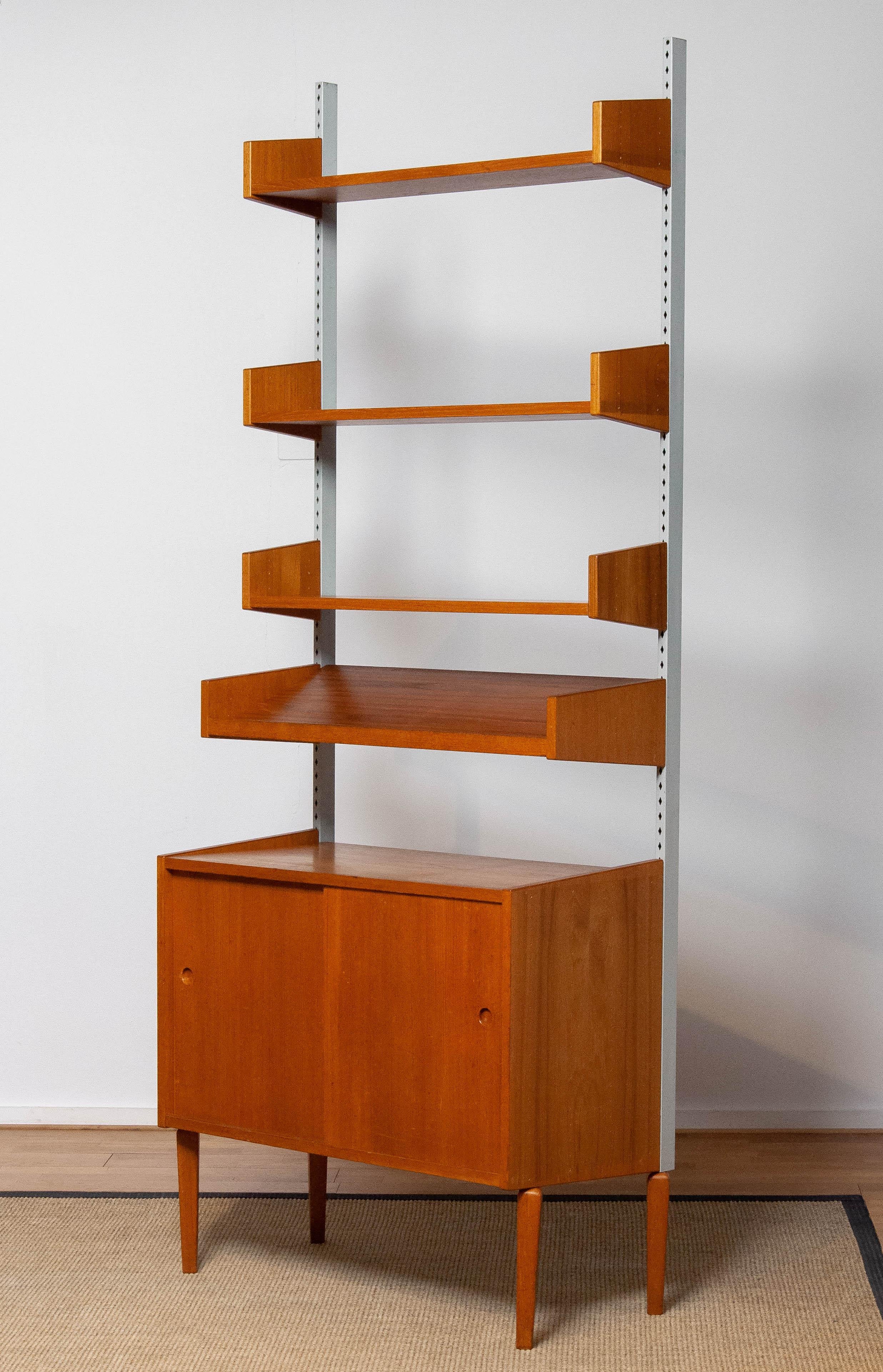 Mid-20th Century Teak Shelf System / Bookcase In Teak With Steel Bars By Harald Lundqvist 1950's
