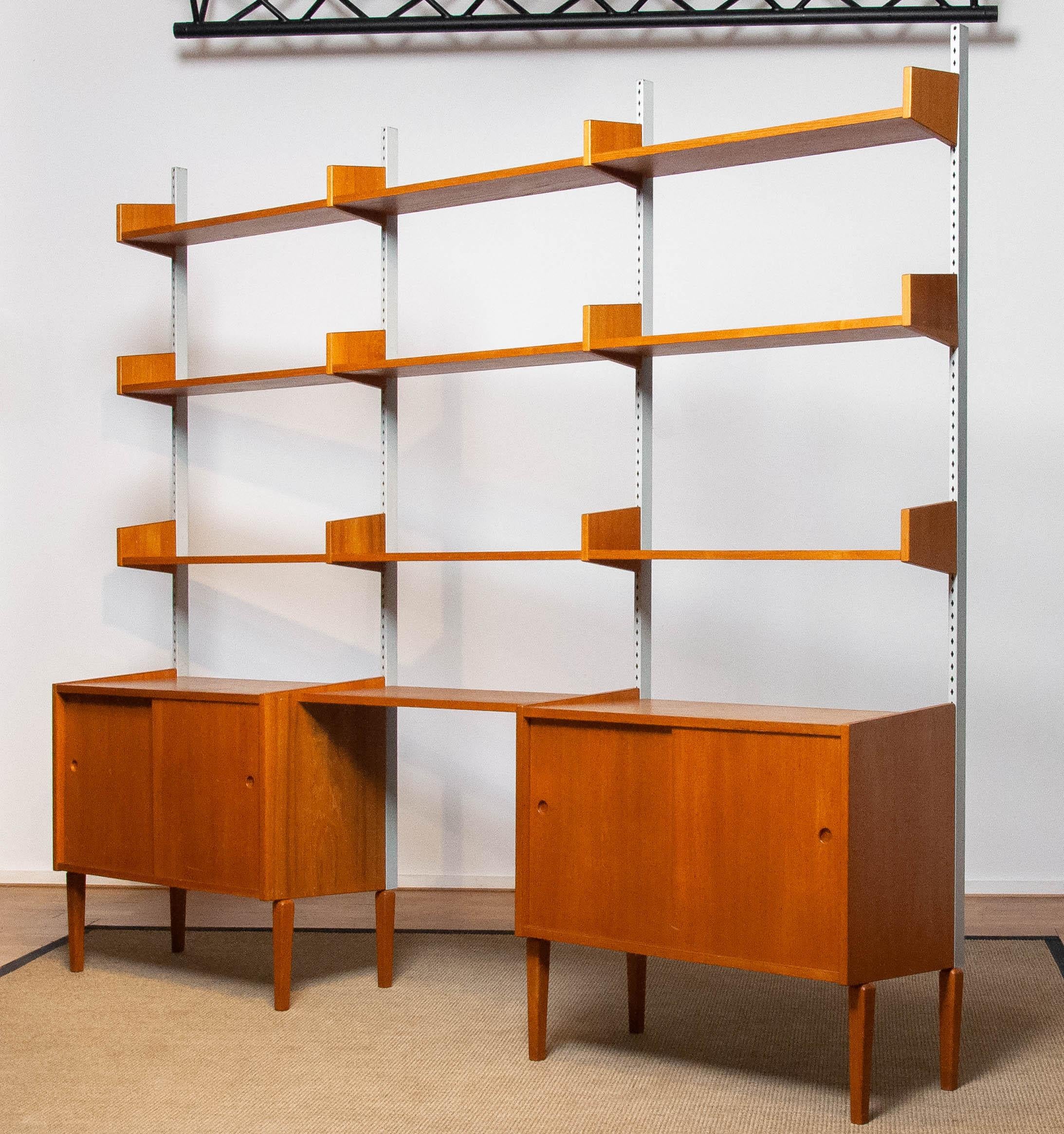 Mid-Century Modern Teak Modulair Shelf System / Bookcase with Steel Bars by Harald Lundqvist 1950