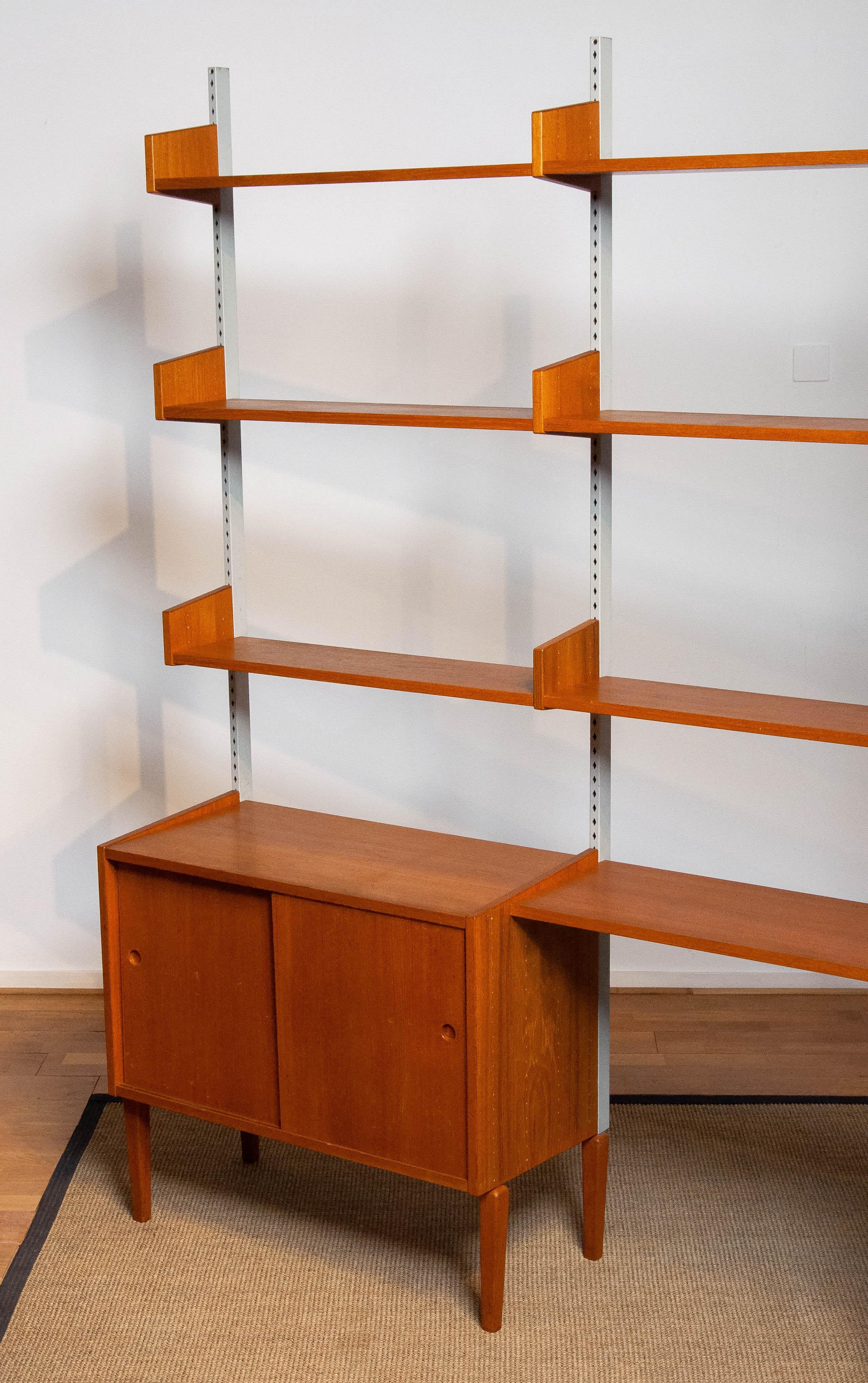 Swedish Teak Modulair Shelf System / Bookcase with Steel Bars by Harald Lundqvist 1950