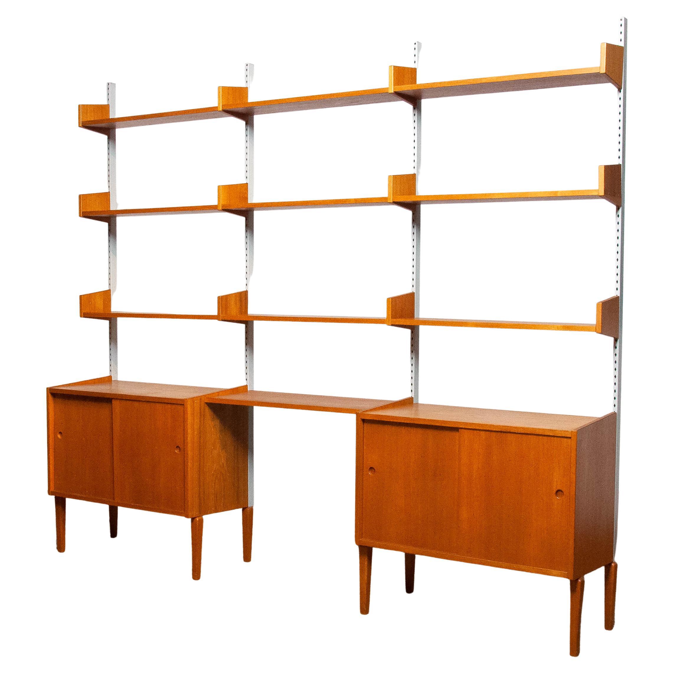 Teak Modulair Shelf System / Bookcase with Steel Bars by Harald Lundqvist 1950
