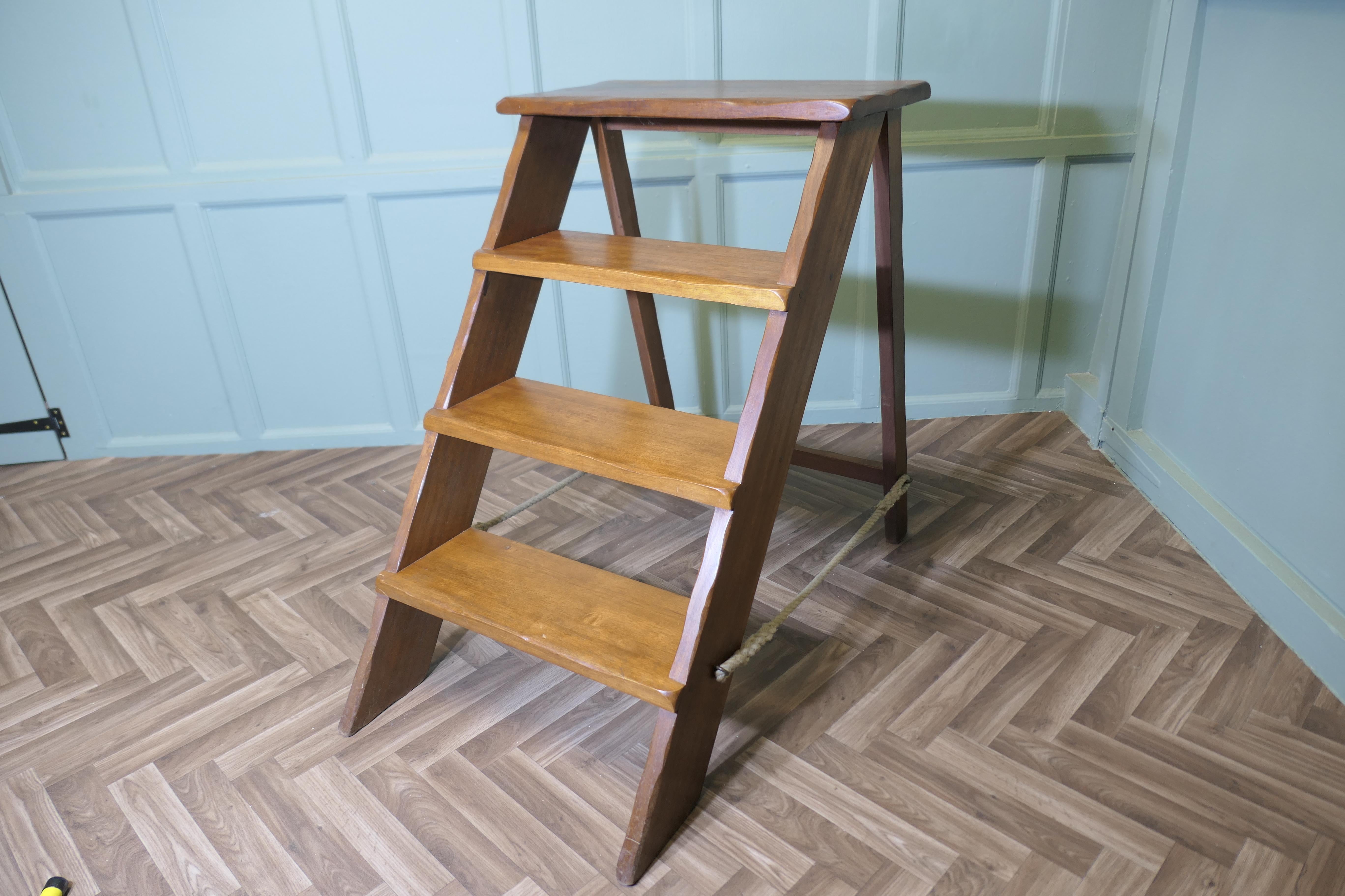 Teak Shop Display Unit

The steps are made in Teak, heavy and sturdy, it makes a superb useful and decorative piece anywhere where sturdy extra height is needed, they fold away when not needed
The full height is 37” tall to the top platform, 26”