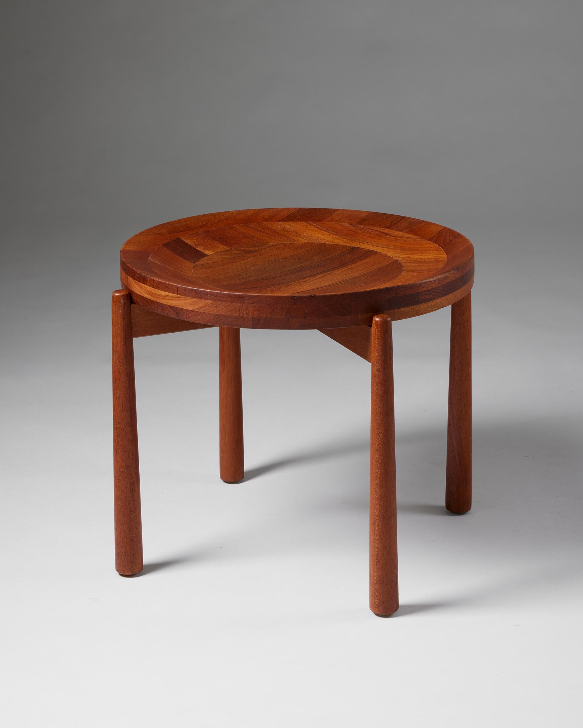 Side table designed by Jens Quistgaard,
Denmark, 1950s.

Teak.

H: 44 cm 
Diameter: 55.5 cm 