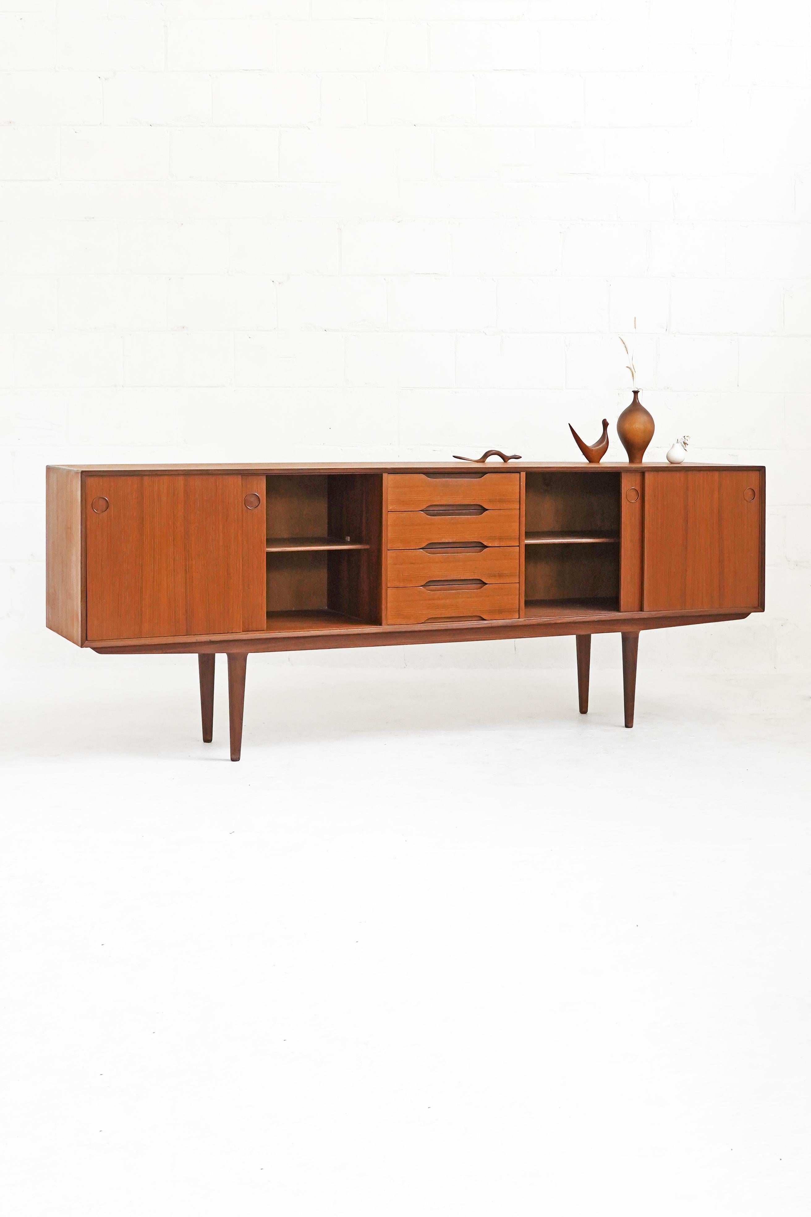 Beautiful teak sideboard by Fredrik Kayser, featuring gorgeous rich teak grain on top, front and side surfaces, with subtle and fine detailing throughout. A great piece in overall good vintage condition.
