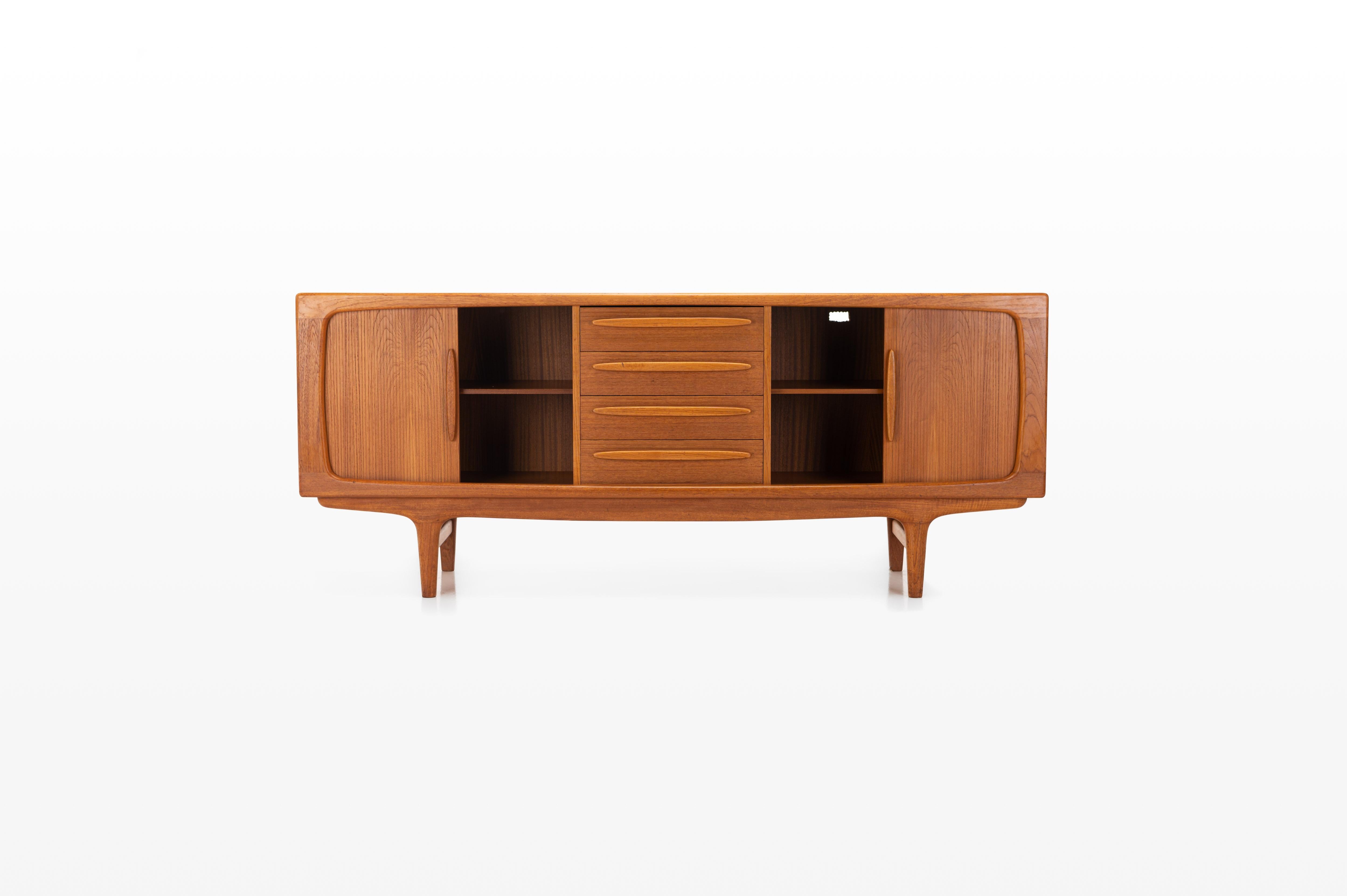 Danish vintage sideboard designed in the 1960s in Denmark by Johannes Andersen for CFC Silkeborg Denmark. Teak version with tambour doors and four drawers.