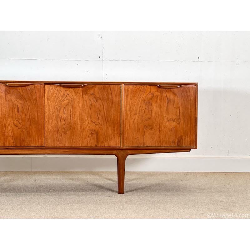 Tom Robertson designed dunvegan sideboard in teak wood for A.H. McIntosh in Scotland in the 1970s.

Tom Robertson updated this model in the early ’70s, belongs to its Dunvegan collection, and has been modified with long legs instead of the metal
