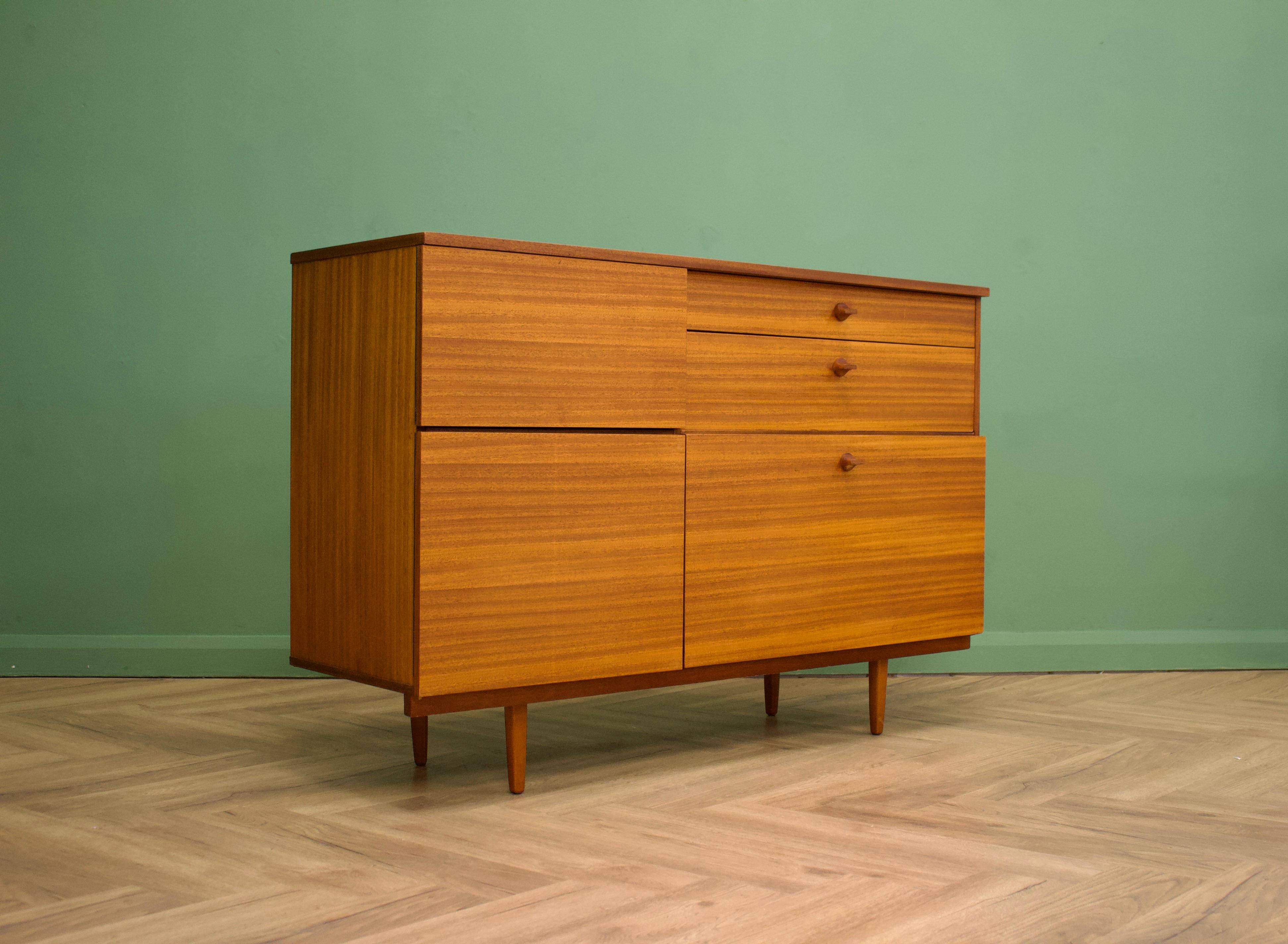 - Mid century drinks cabinet / dry bar / sideboard.
- Manufactured in the UK by Avalon
- Made from teak and teak veneer.