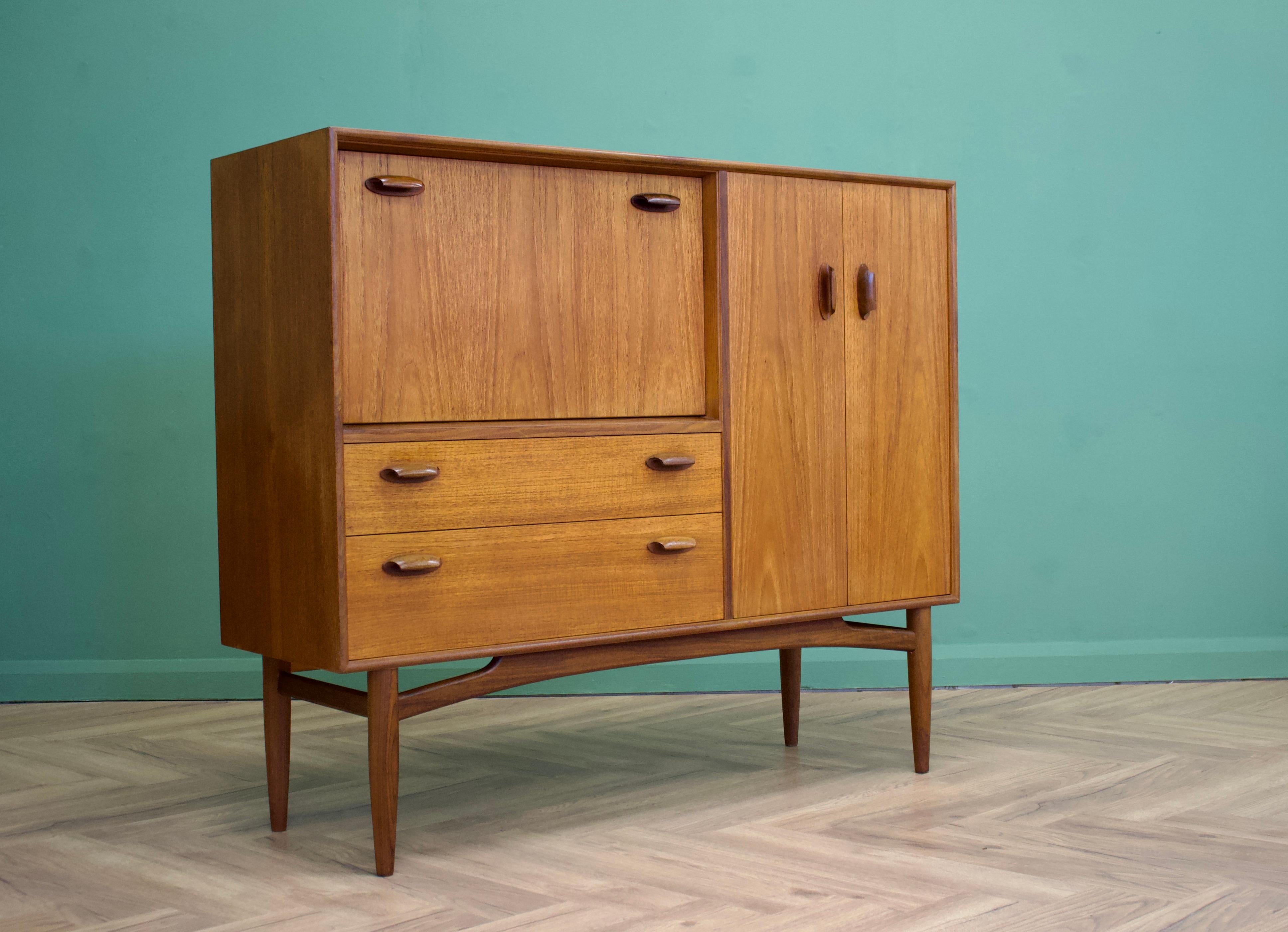 - Mid century drinks cabinet / dry bar / sideboard.
- Manufactured in the UK by G Plan.
- Made from teak and teak veneer.