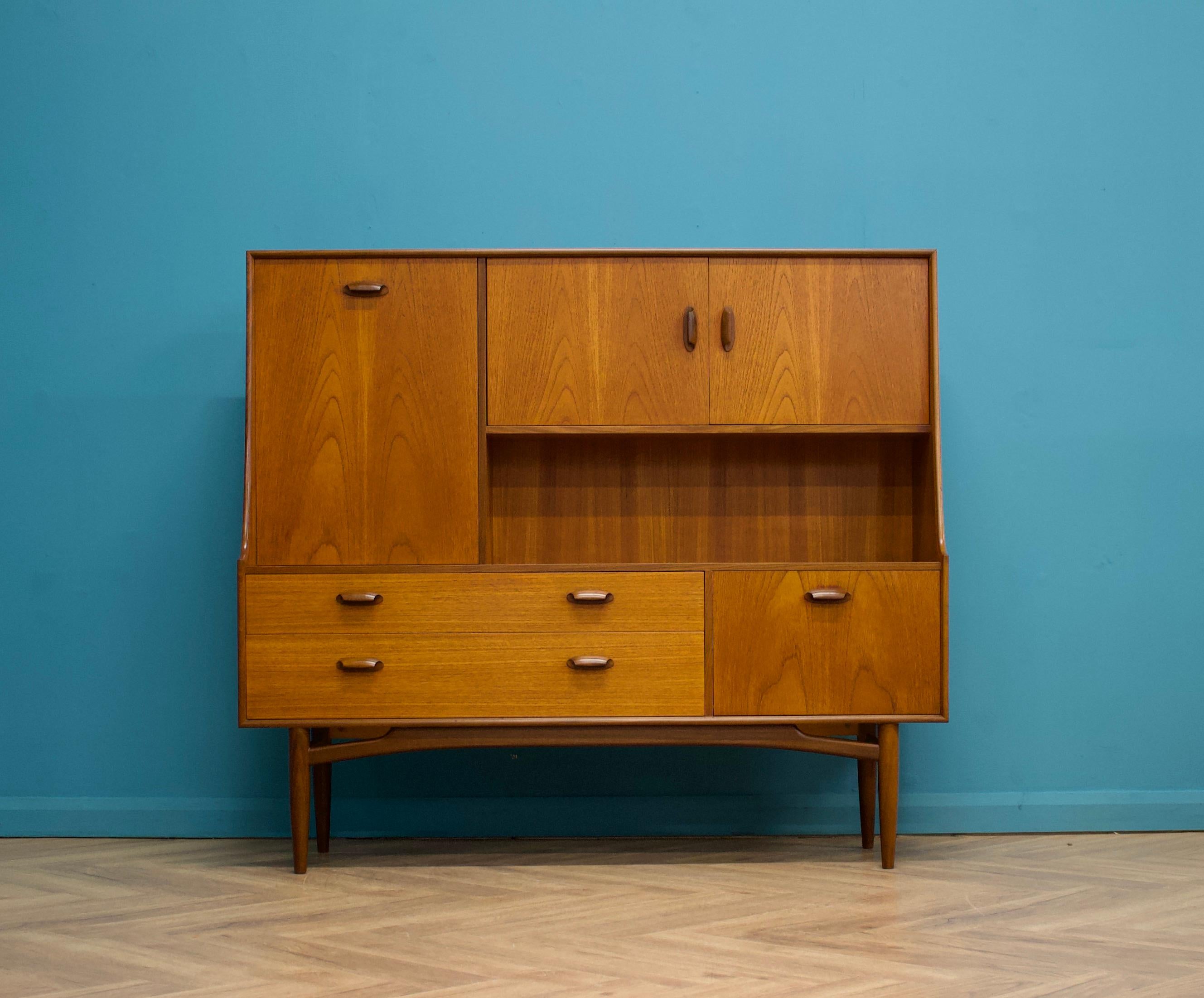 A compact size teak drinks cabinet or highboard from G Plan - Circa 1960s

It features a two cupboards, a pull down drinks compartment, two drawers and removable shelves

