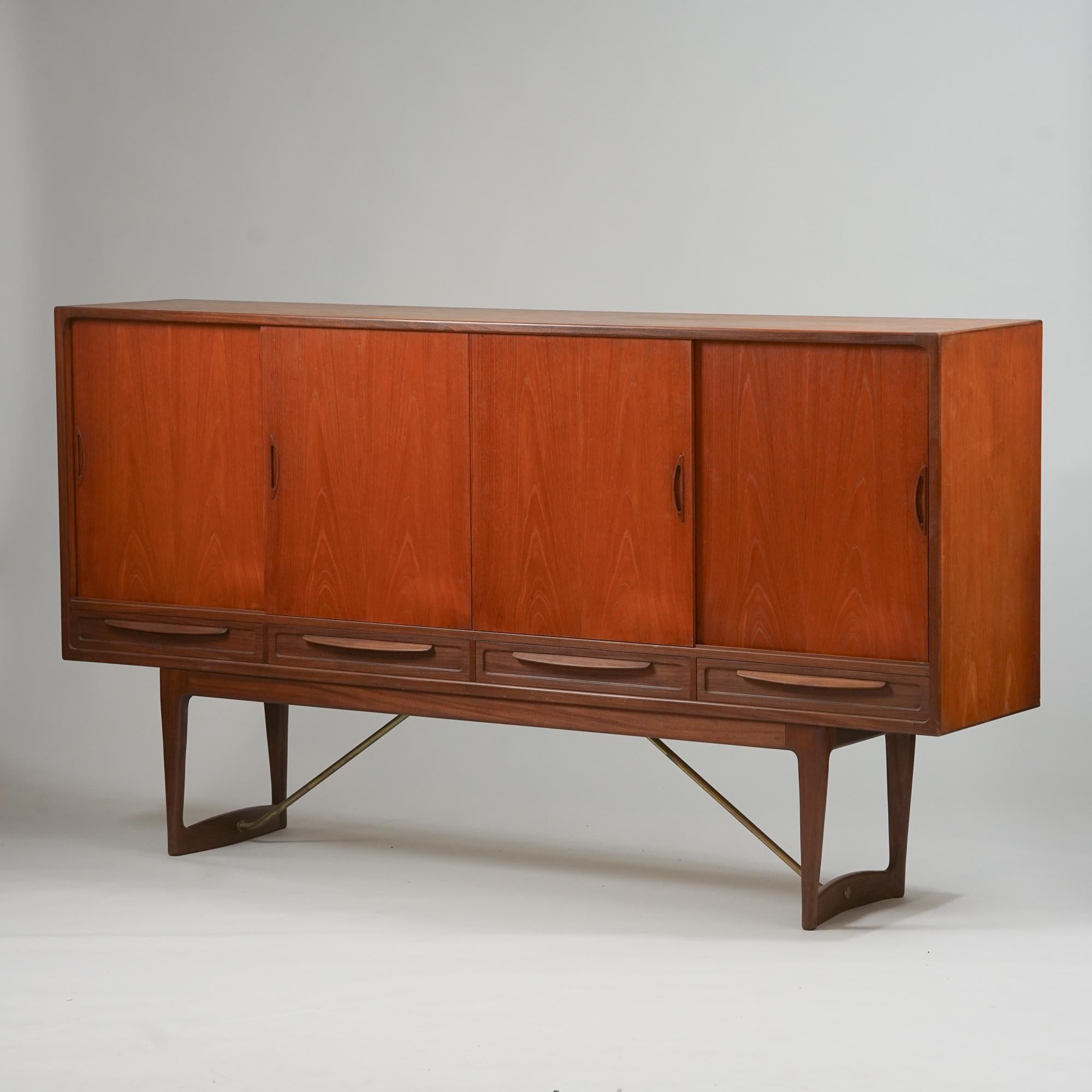 Teak sideboard, designed by Sofus Jørgensen, manufactured in Denmark, 1960s. Teak with brass details on the legs. Drawers on the left and shelfs on the middle and the right side. Shelf height is adjustable. The bottom drawers have a green felt