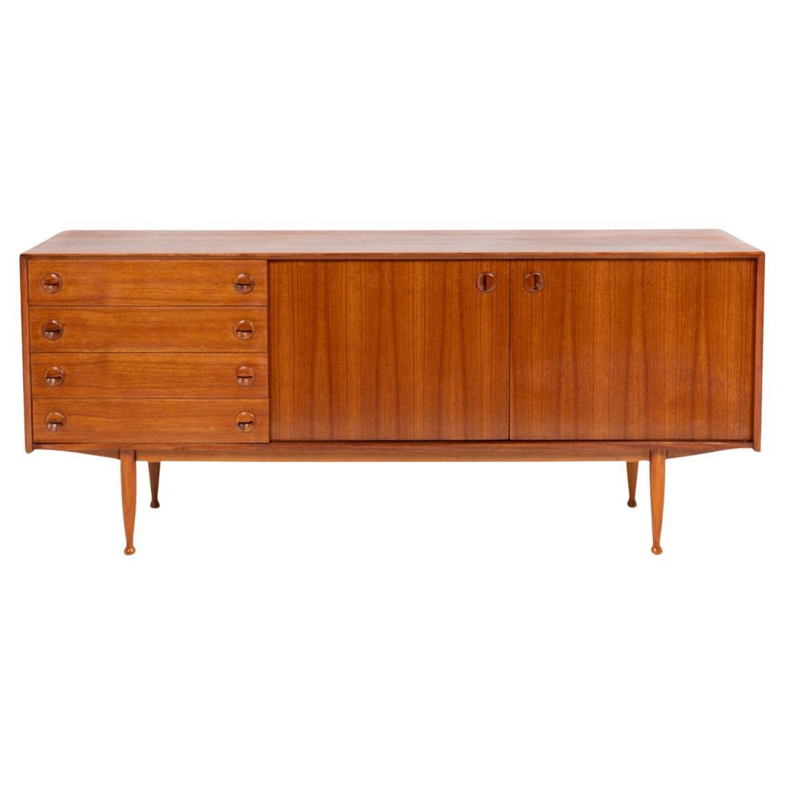 Teak sideboard, with four drawers and two doors. 20th century. For Sale