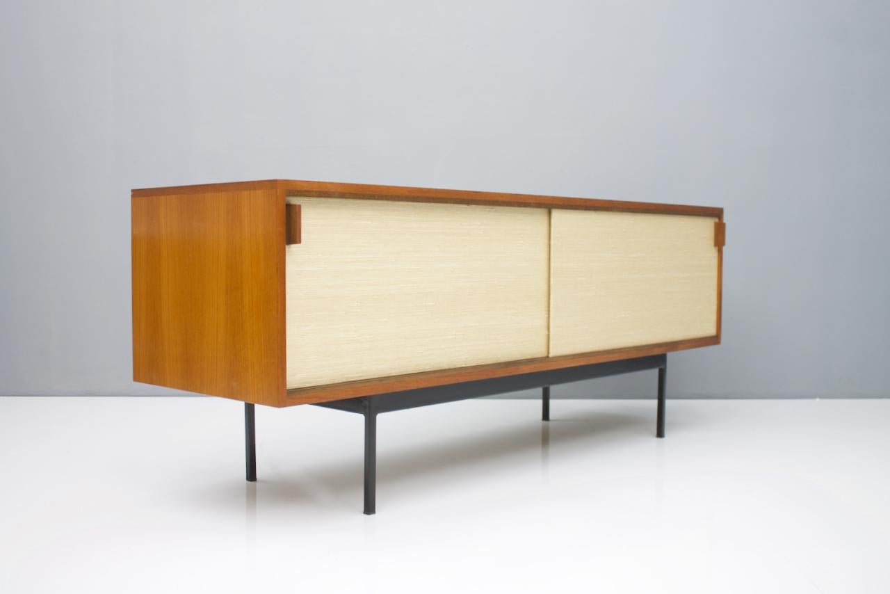 Teak sideboard with seagrass and two sliding doors and black metal base. Dieter Waeckerlin for Behr.
Measure: Wide 174cm, height 70cm, depth 53cm.
Good condition with scratches on the top, please see the pictures


Worldwide shipping.

 