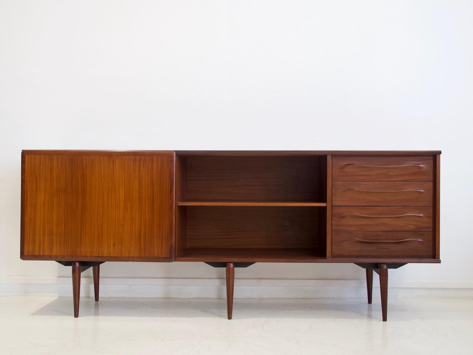 Sideboard veneered with teak, circa 1950-1960. Produced by Amma in Italy. Fitted with sliding doors, drawers and interior shelves. The surface has been restored, minor signs of age-related wear.