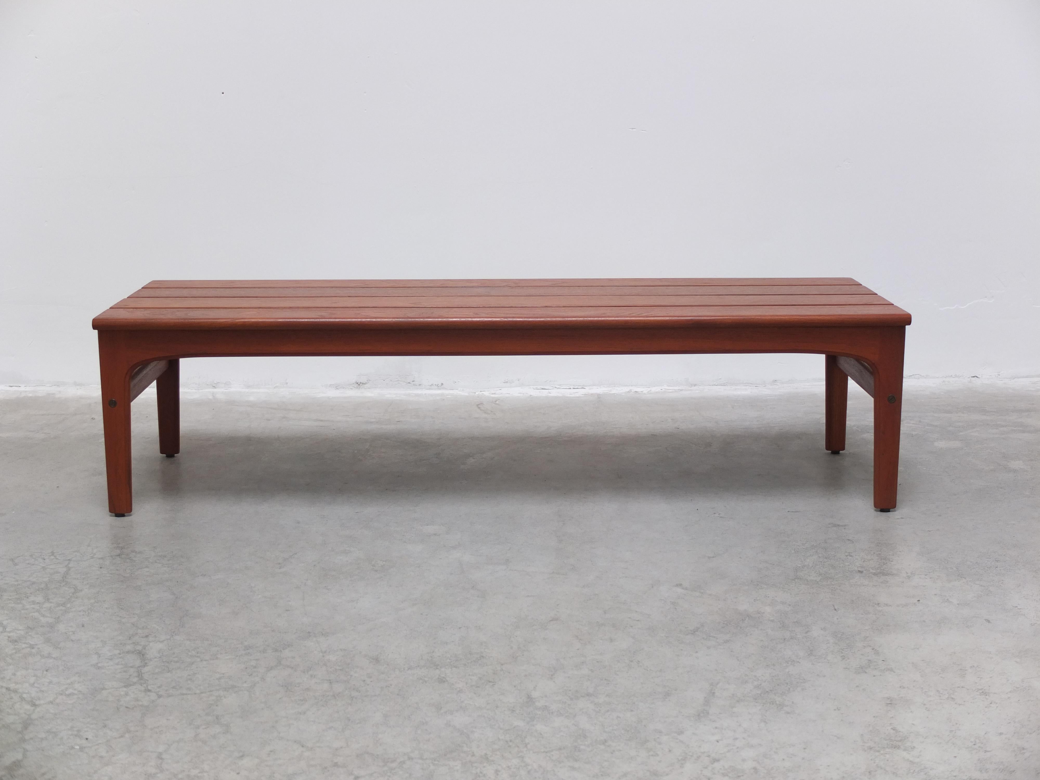 A beautiful slatted bench or coffee table designed by Yngvar Sandström for AB Sëffle Möbelfabrik during the 1960s. Made of solid teak and in mint restored condition. Brought back straight from Sweden during our last buying trip. Labeled by the