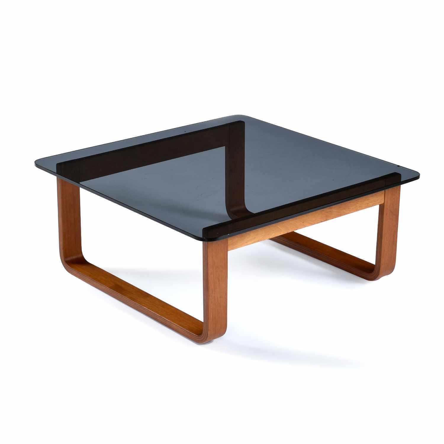 Minimalist Tessa T4 M square side table & rectangle coffee table set designed by Fred Lowen. The vintage 1970s side tables feature 3/8″ thick smoked glass top with rounded corners. The rounded corners are both elegant and easy on the shins. The