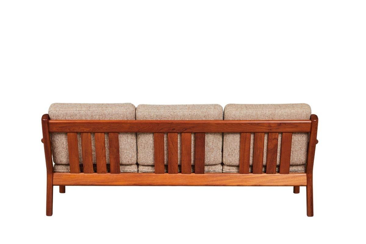 Teak living room set 3-seater sofa + armchair designed by Juul Kristensen for Glostrup Mobelfabrik. Made in Denmark in the 1960s, the original sticker has been preserved. The whole thing is made of solid teak, upholstery in light natural beige