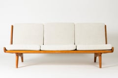 Teak Sofa with Leather Webbing by Gustaf Hiort af Ornäs, Finland, 1950s