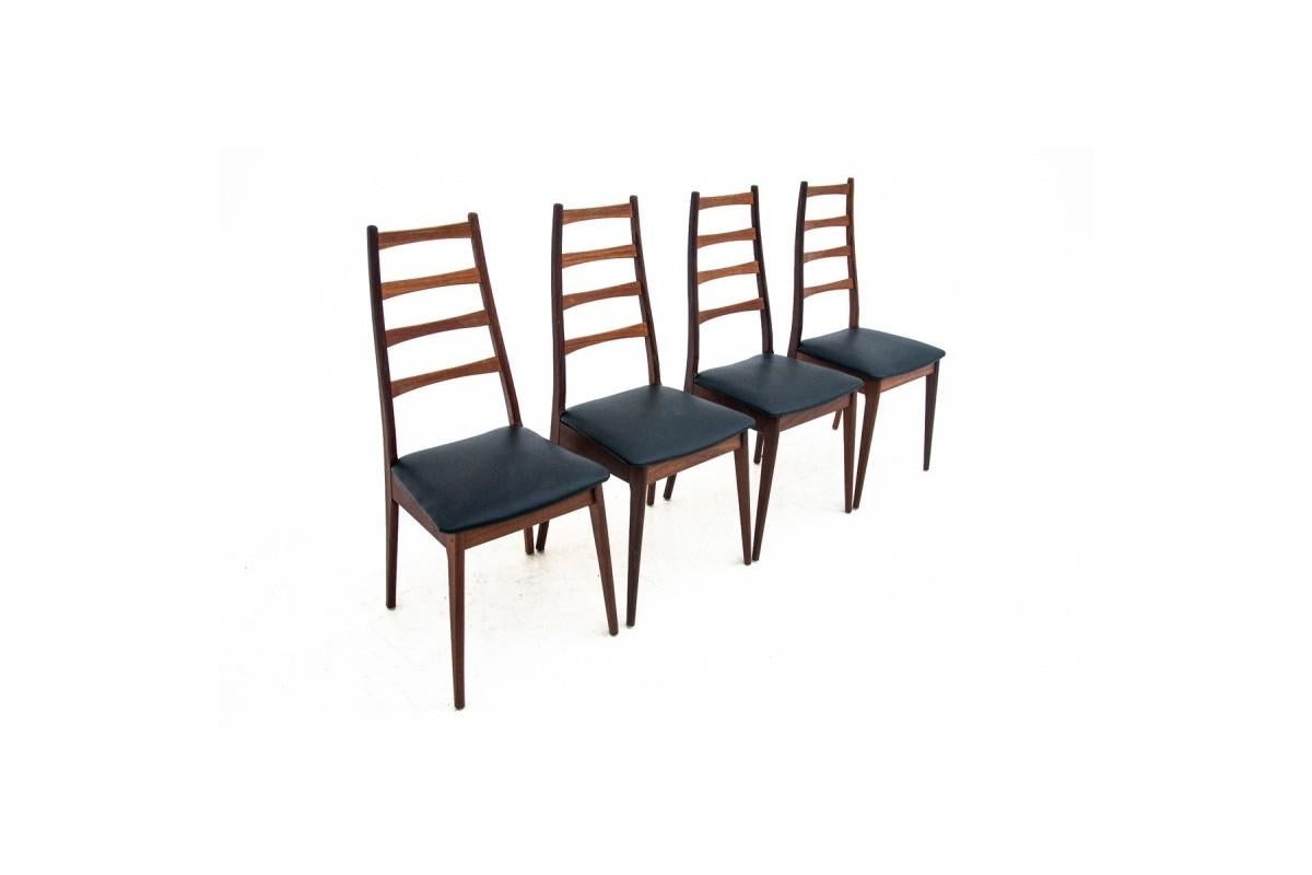A table with chairs from Denmark, furniture made in Denmark.
Made of teak wood. 
Chairs upholstered with black italian natural leather. 
Dimensions:

Chairs: height 98 cm / height of the seat 46 cm / width 43 cm / dep. 47 cm

Table: height 72