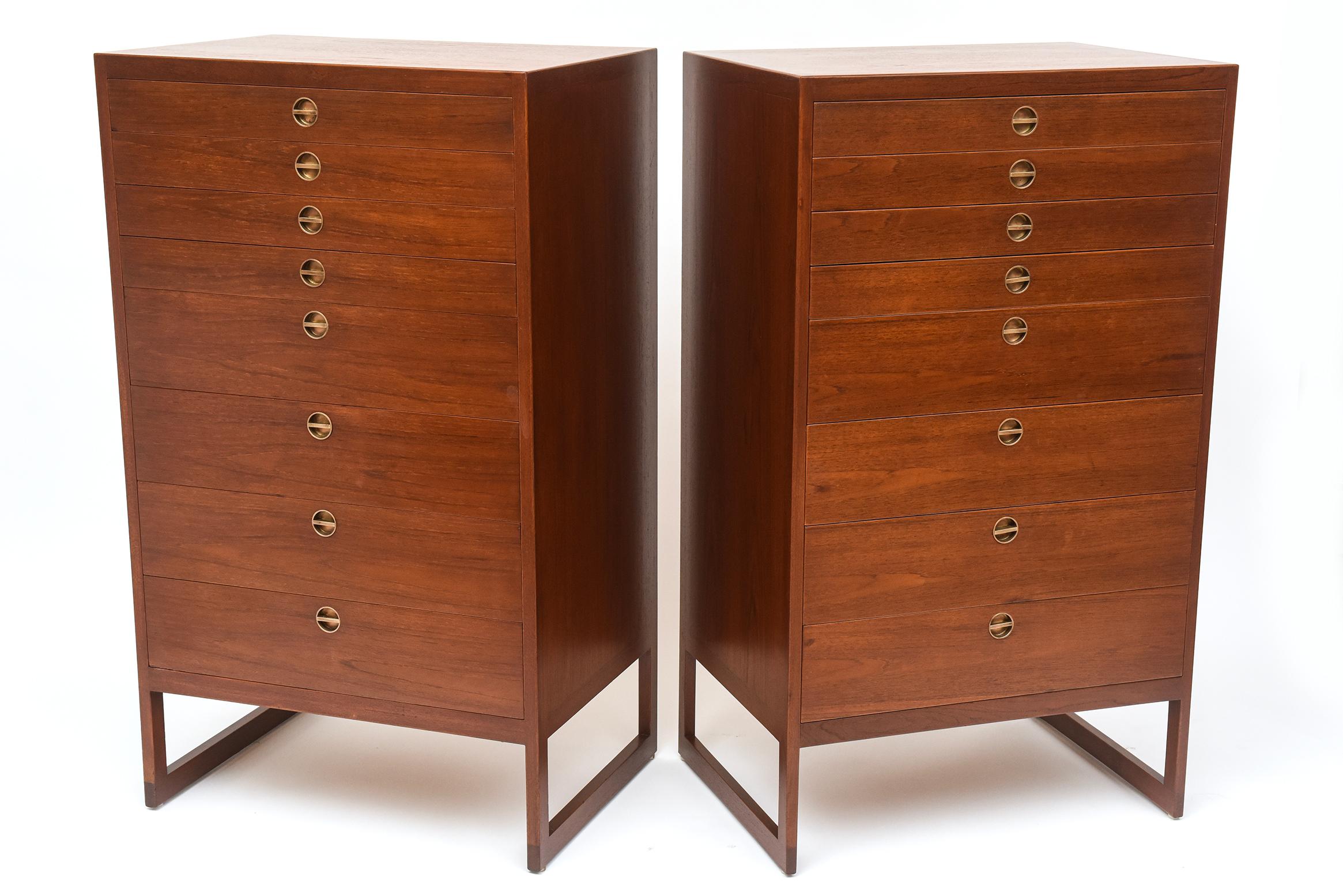 Desirable teak tallboy chests with inset brass handles, designed by Børge Mogensen (Model Bm-64) in 1957 and manufactured by cabinetmaker P. Lauritsen, in Denmark, circa 1960. Four narrow drawers stack over four wide drawers (all in solid combed