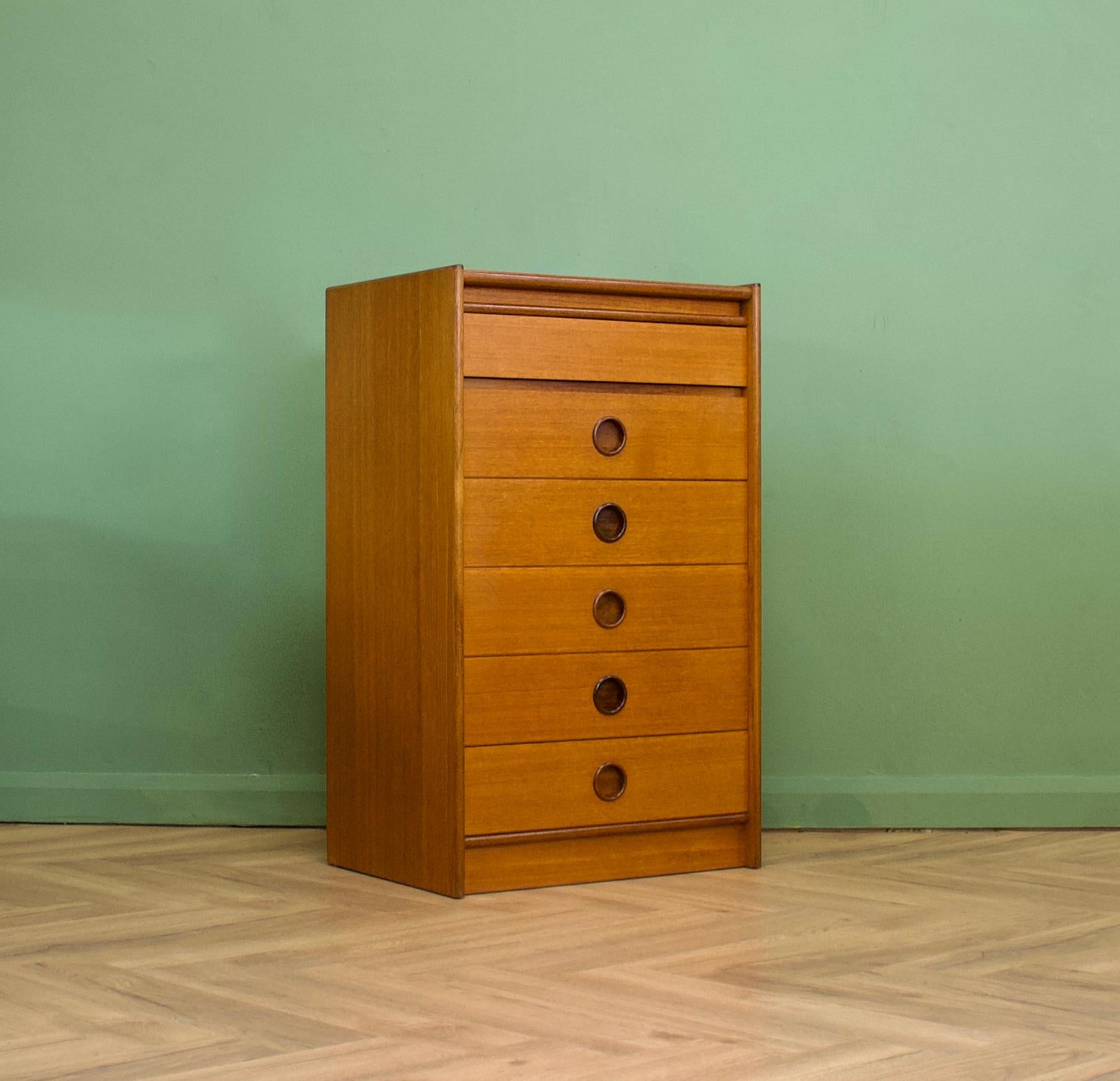 A mid century walnut tallboy chest of drawers from the quality furniture makers, Bath Cabinet Makers
There are six drawers in total - each having a recessed, solid teak, round handle