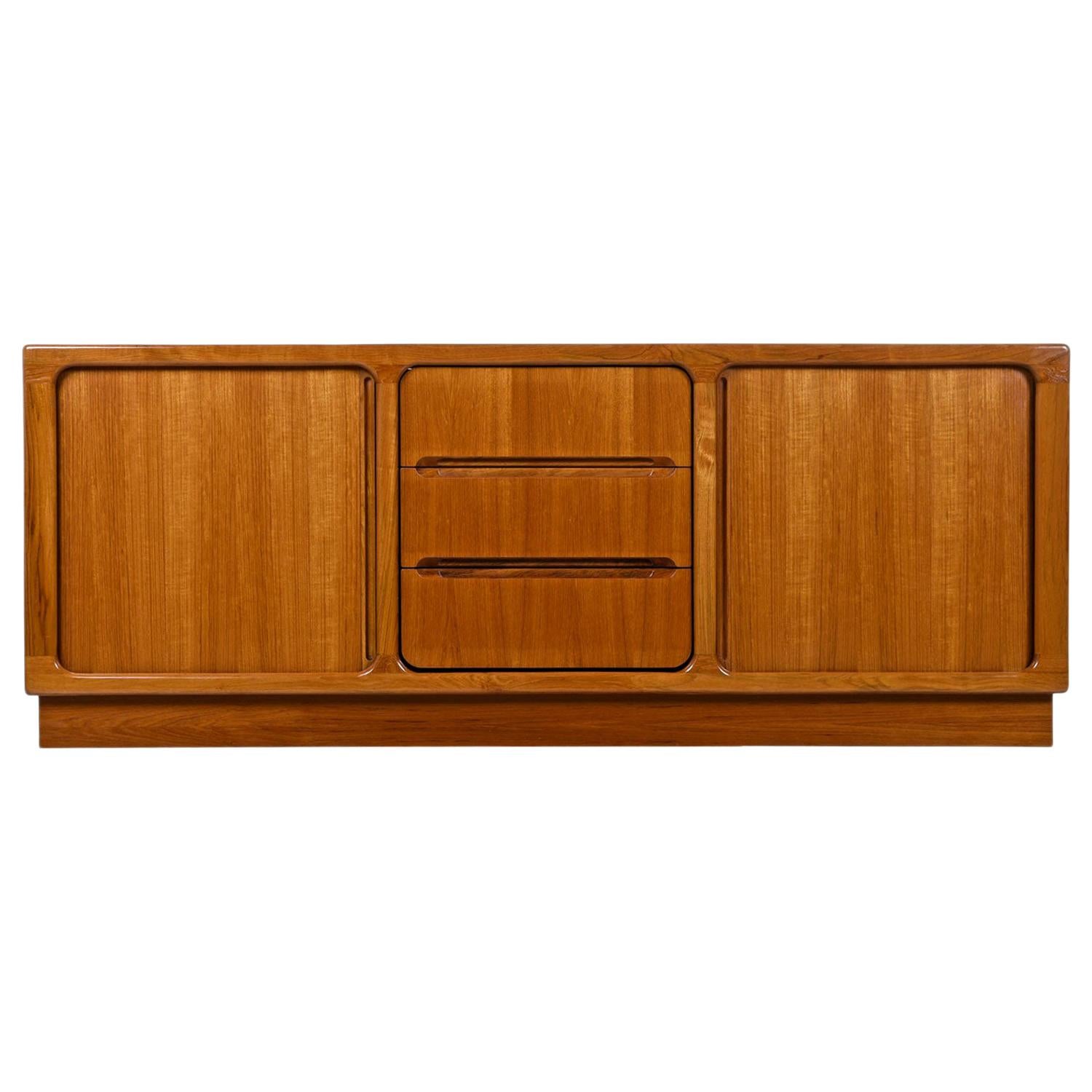 Gorgeous Scandinavian Modern teak tambour media cabinet by Sun Cabinet. Beautifully crafted and remarkable are the two individual tambour doors with thin bands of teak so finely assembled that the doors appear to be one solid sheet of teak. This