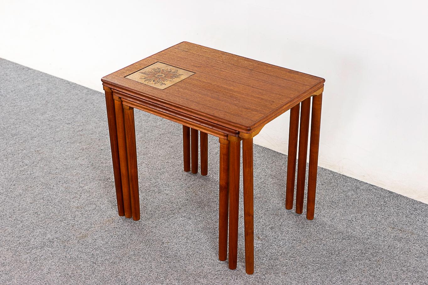 Teak & tile nesting tables, circa 1960's. Space saving design offers the footprint of one table with the functionality of three!

Unrestored item with option to purchase in restored condition for an additional $150 USD. Restoration includes:
