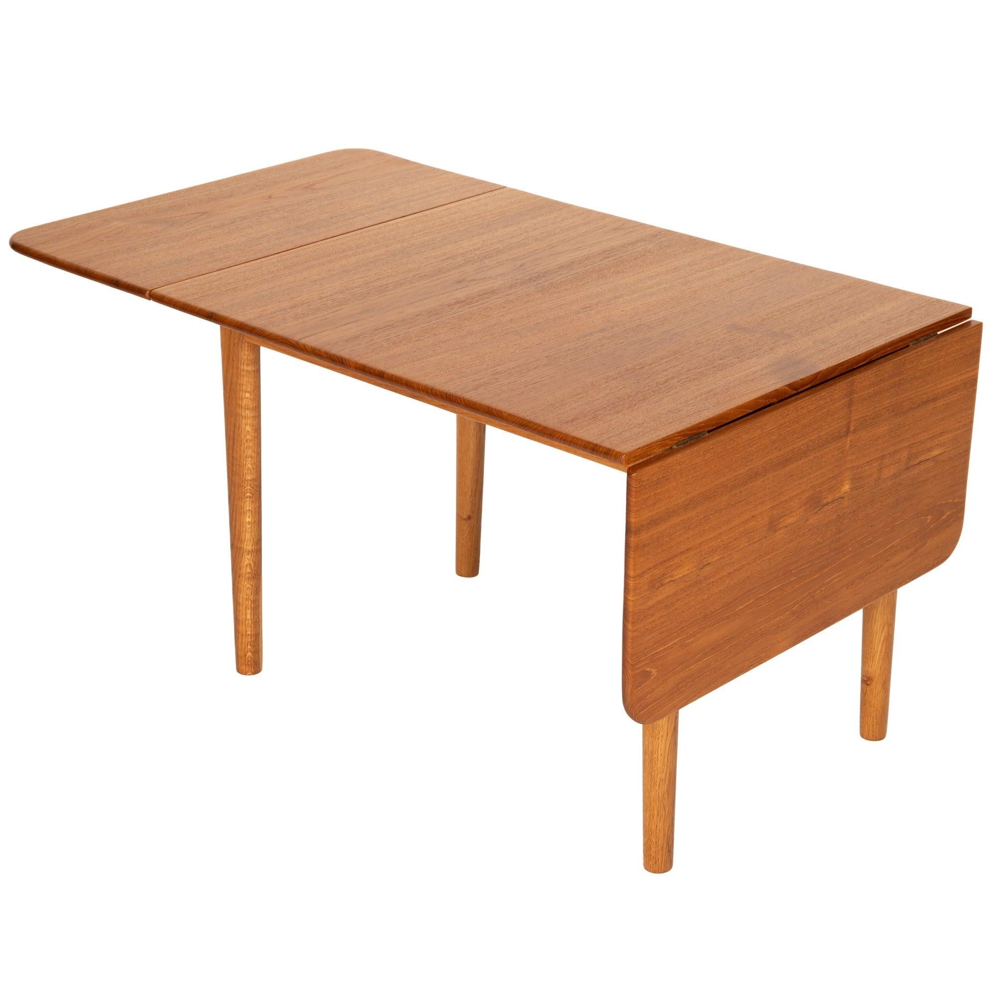 A teak drop leaf end / side table.