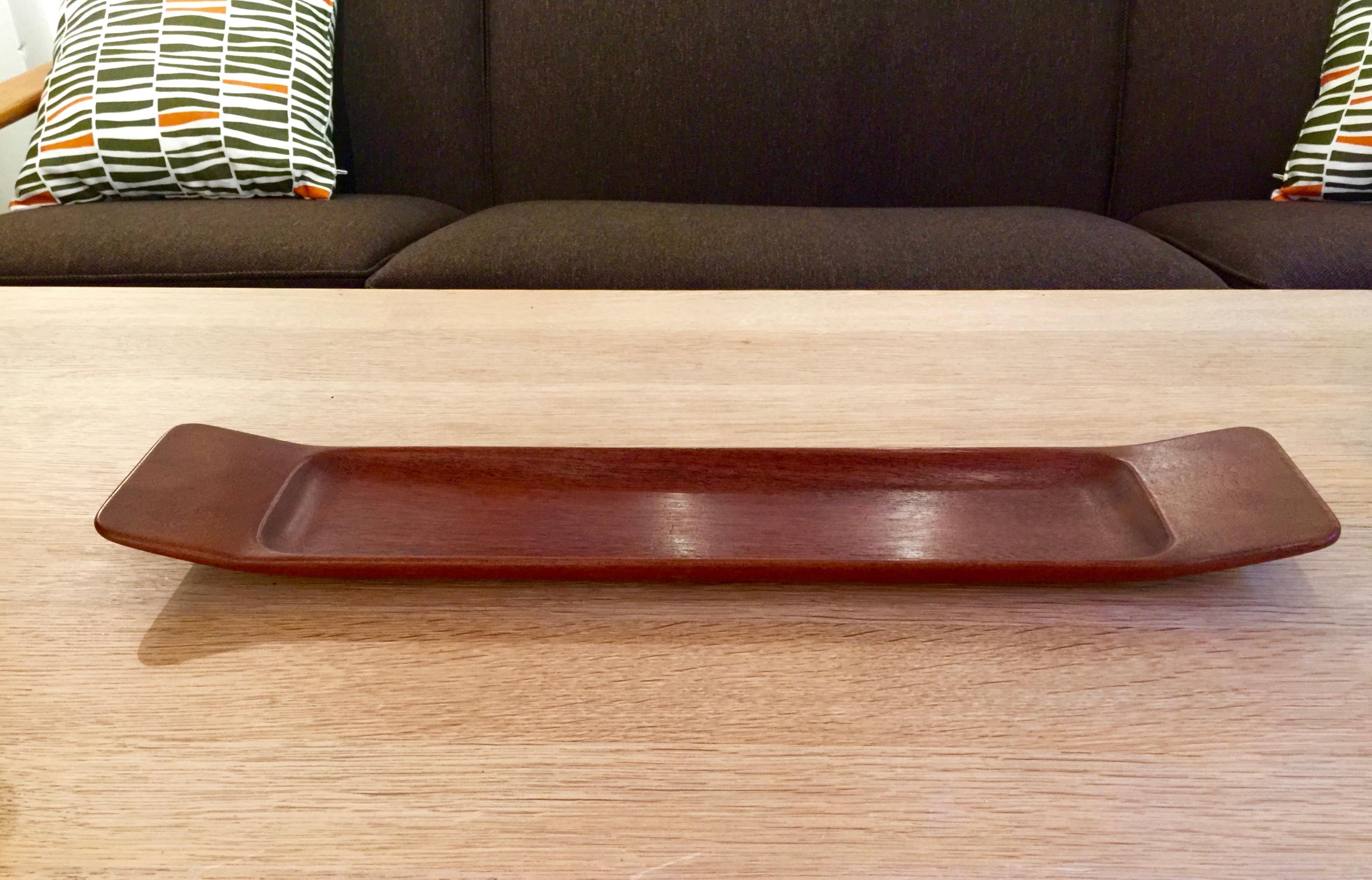 Large teak tray carved out of one piece of wood by Swedish master craftsman Johnny Mattsson. Signed underneath.