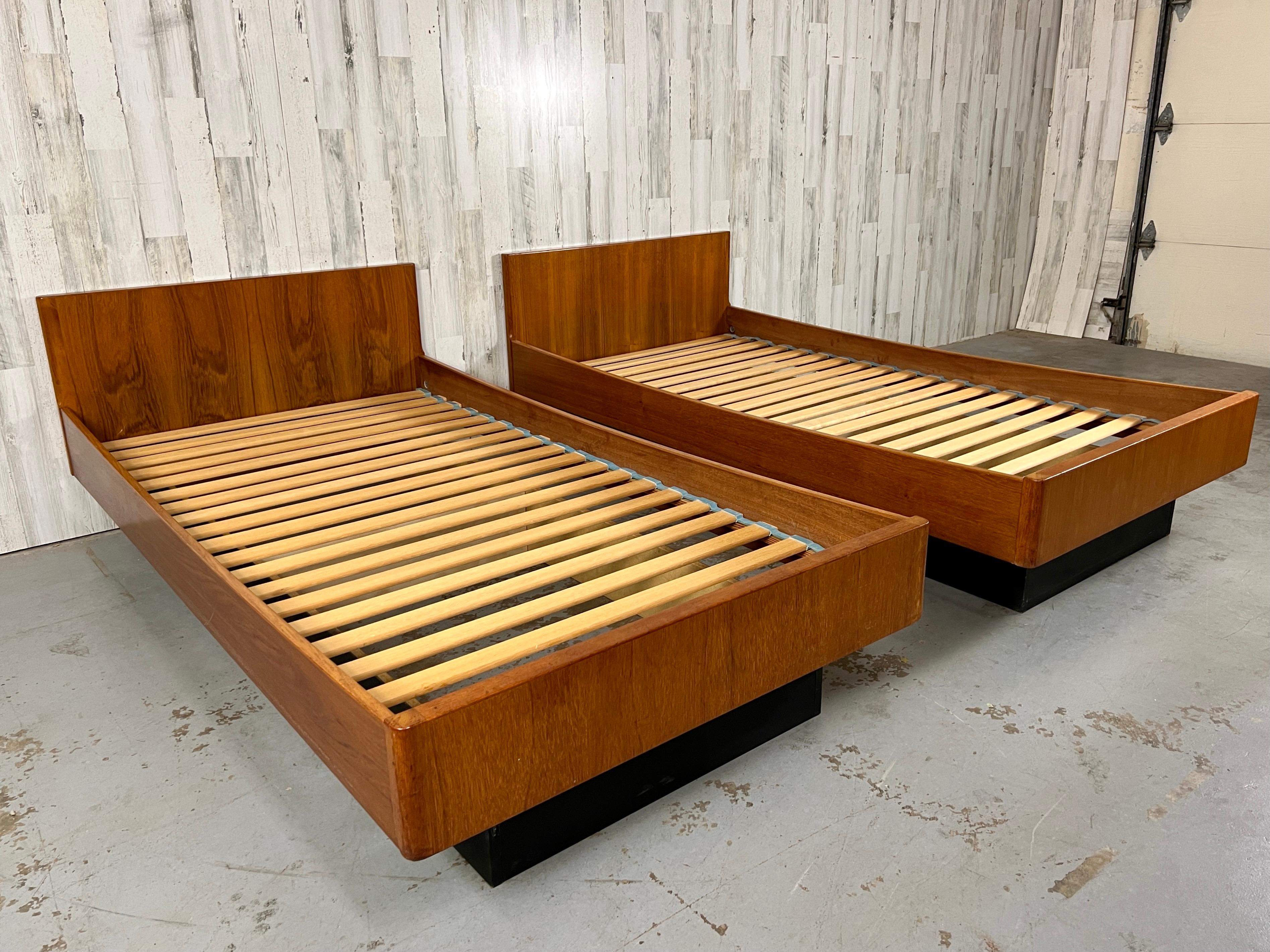 Teak Twin Platform Beds made by W&B Axelsens Mobilfabrik. A combination of  solid and teak veneer make this pair of beds very dramatic, or they can be pushed together for a king-size bed.

Footboard 15 1/8