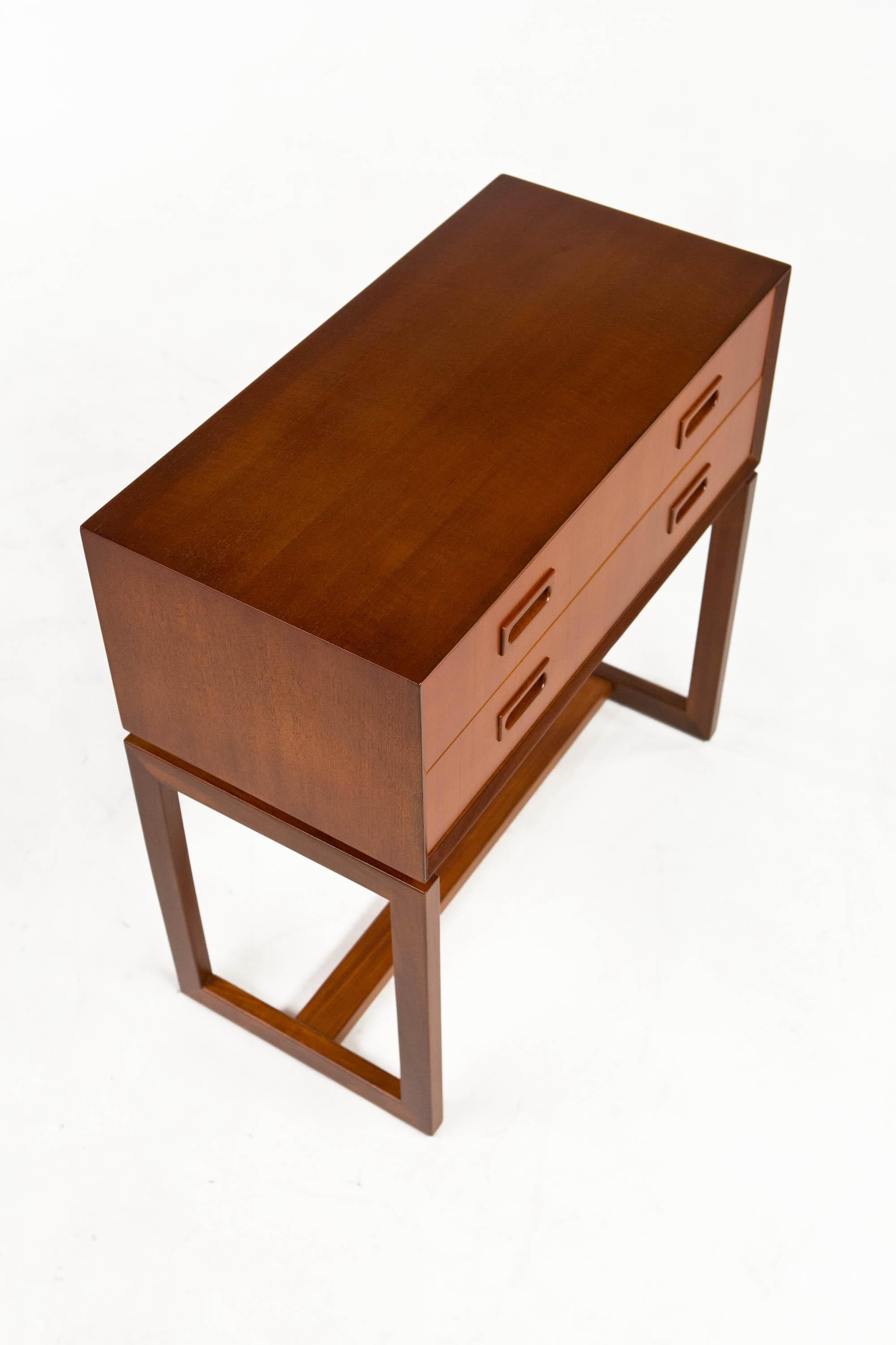Teak two drawer bureau with Beveled edge - Danish design 1950's

Lovely smaller two drawer teak bureau with beveled edge details and solid carved pulls and clean architectural base.

Fully refinished in great condition.