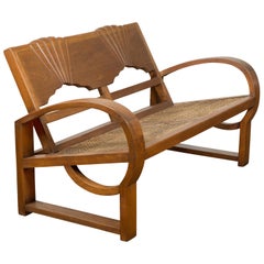 Teak Wood Country Outdoor Bench from Madura with Rattan Seat and Looping Arms