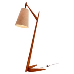 Teak wood floorlamp with Boomerang shape foot