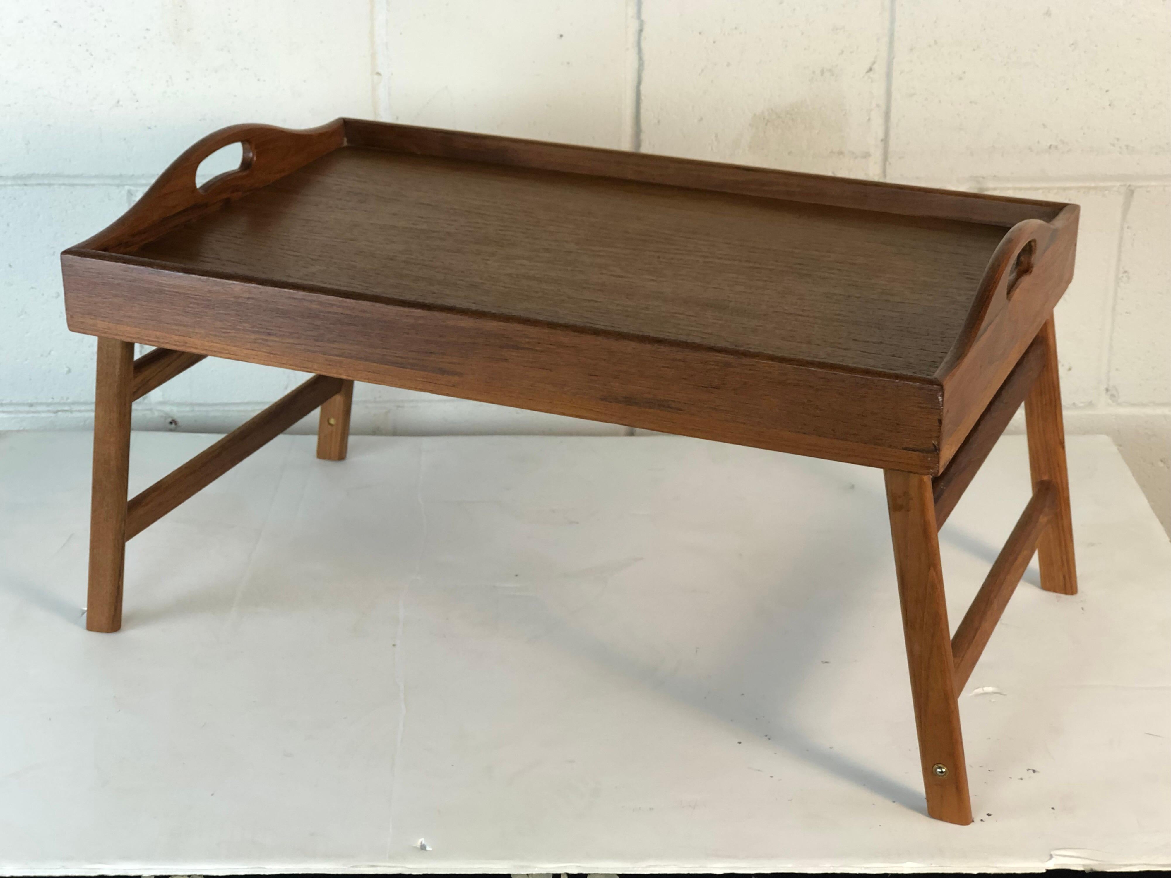 Teak wood folding breakfast serving tray that can be used for a bed serving tray or just a tray. Marked underneath.
Measurements fully open: 22” L x 13.75” W x 12” H.