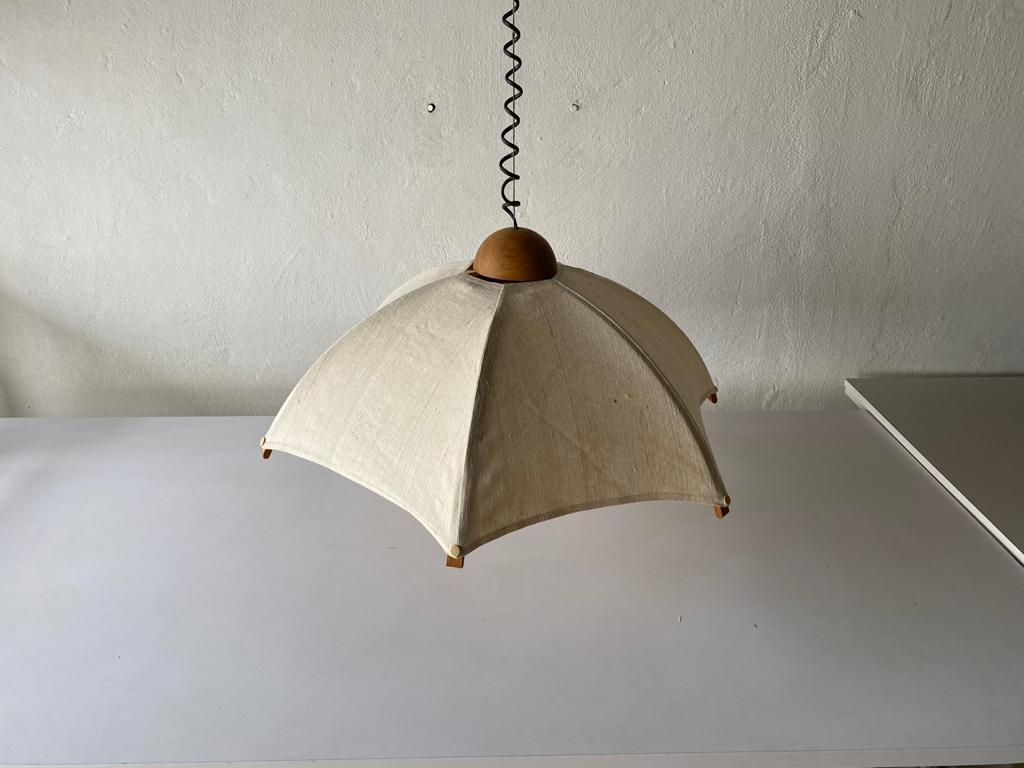 Teak wood frame & fabric shade pendant lamp by Domus, 1980s, Italy

Minimalist and rare design. 

Lampshade is in good condition and clean. 
This lamp works with E27 light bulb. 
Max 100W Wired and suitable to use with 220V and 110V for all