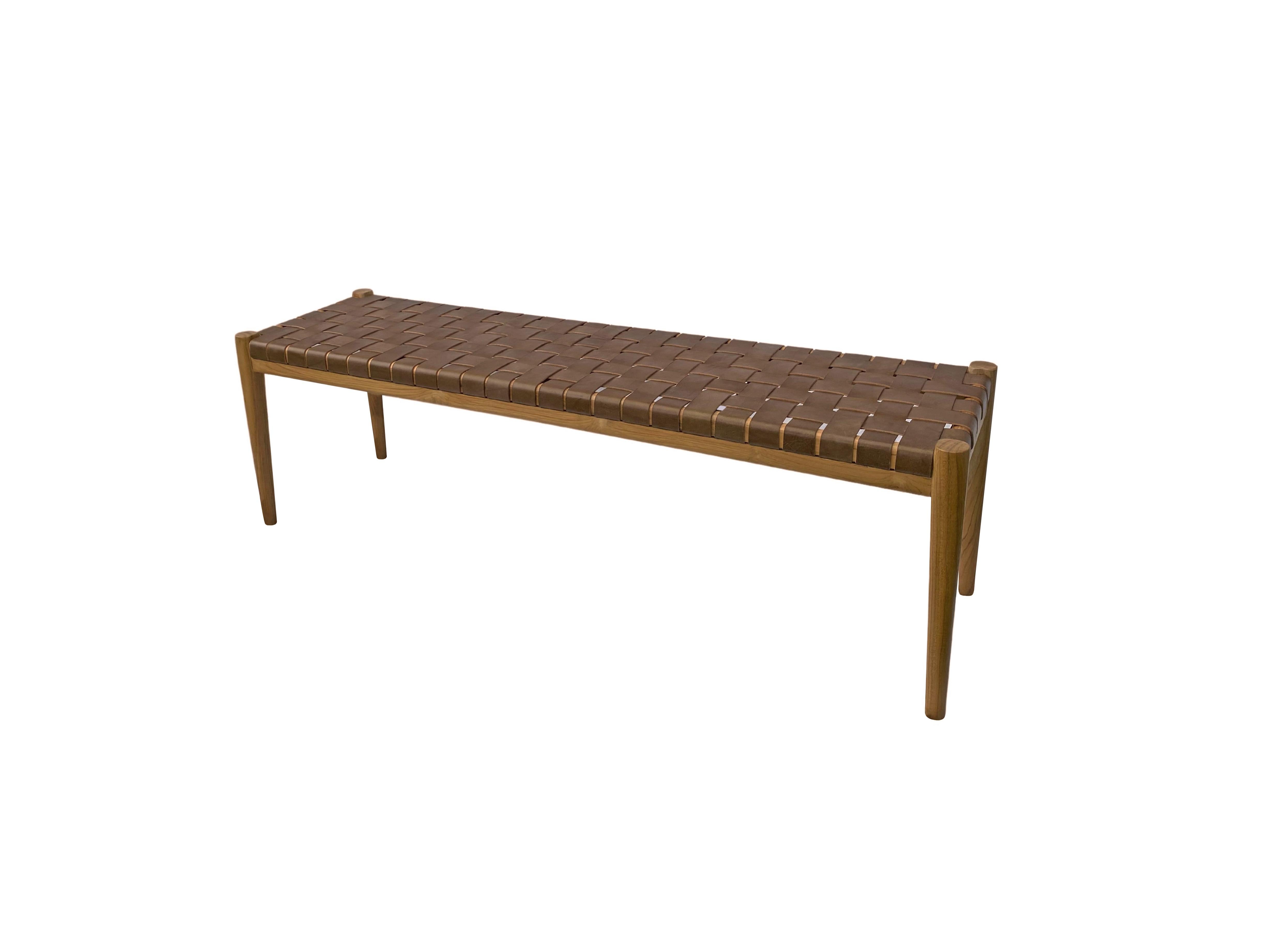 A hand-crafted teak framed & woven leather strap bench. These benches are crafted by local artisans using a wood joinery technique without the use of nails. They feature a subtle wood texture and are robust and sturdy.