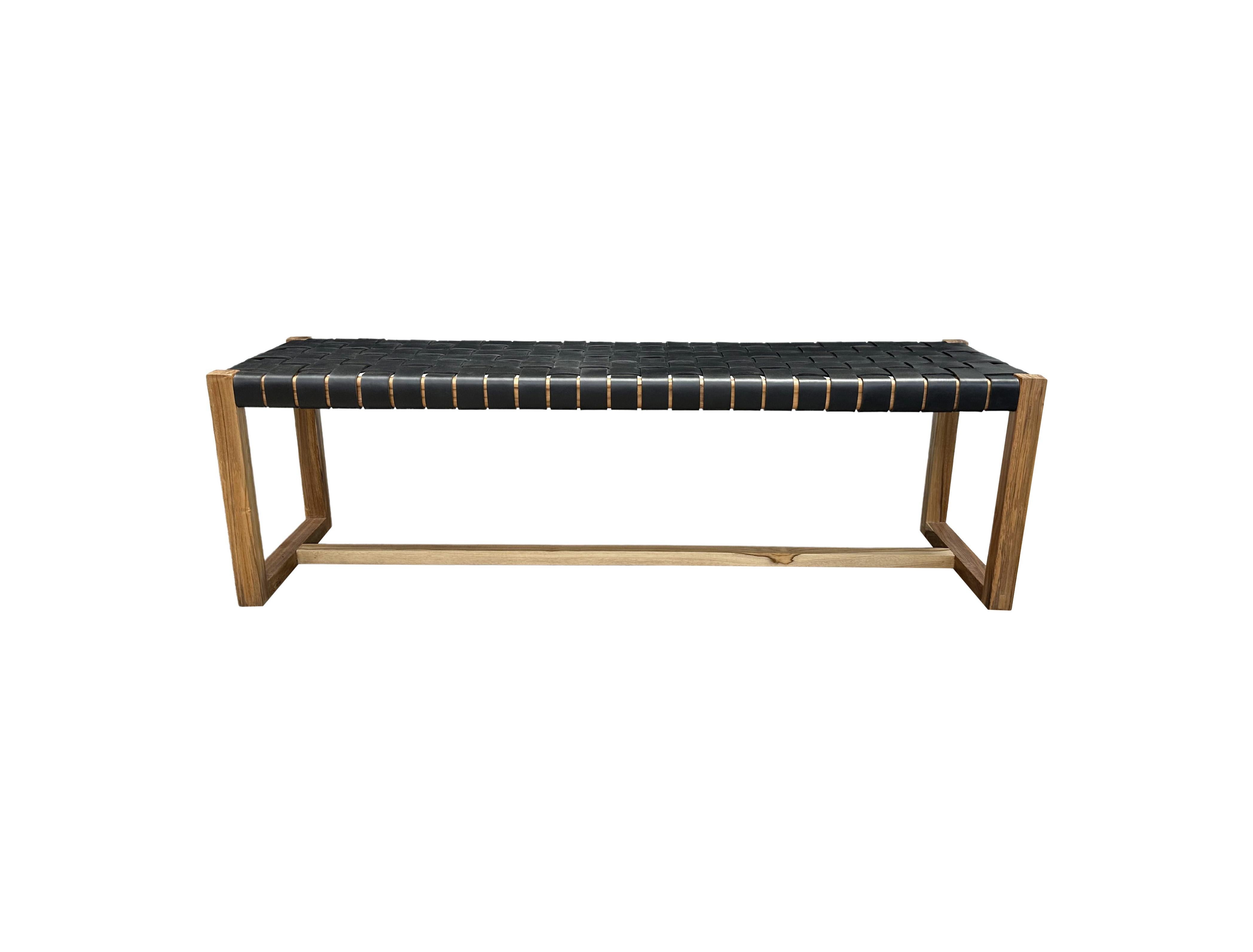 A hand-crafted teak framed & woven leather strap bench. These benches are crafted by local artisans using a wood joinery technique without the use of nails. They feature a subtle wood texture and are robust and sturdy.