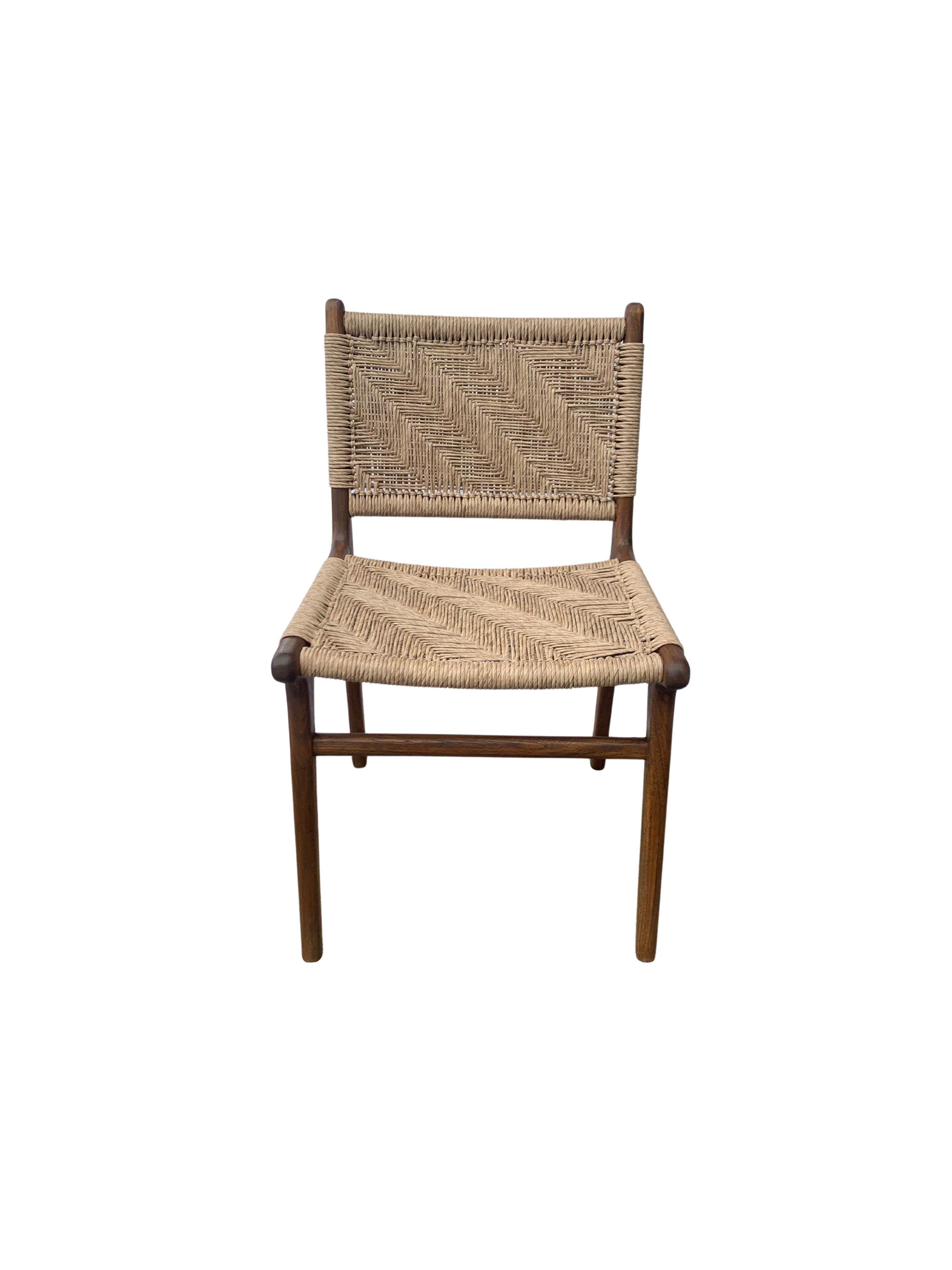A hand-crafted teak framed & woven synthetic rattan chair. These chairs are crafted by local artisans using a wood joinery technique without the use of nails. They feature a subtle wood texture and are robust and sturdy. Synthetic rattan is more low